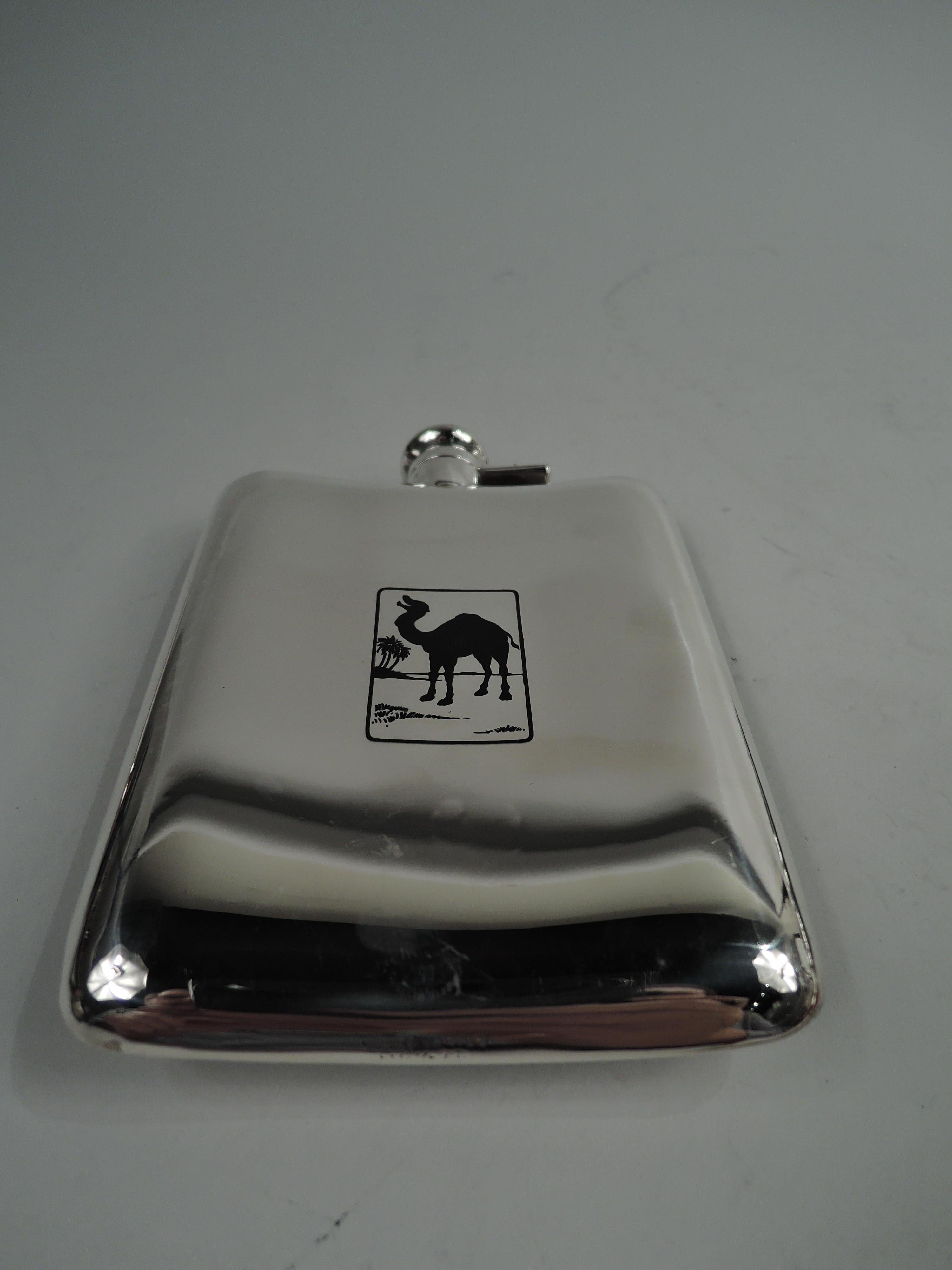 Art Deco sterling silver novelty camel flask. Made by R. Blackinton & Co. in North Attleboro, Mass., ca 1930. Rectilinear and gently curved; cover hinged and cork-lined. On front, in black enamel is a drooping dromedary. On back, the beast is
