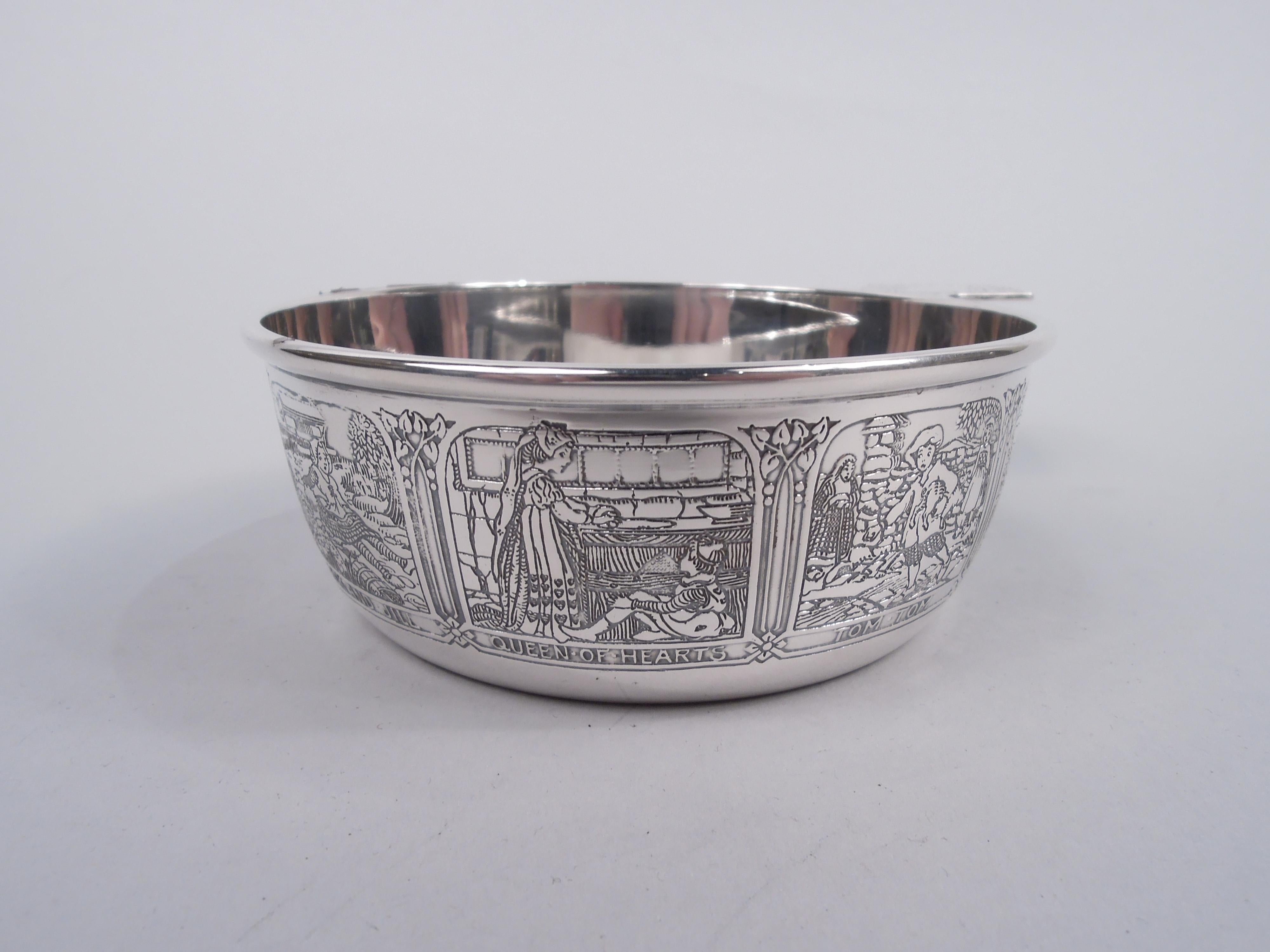 Edwardian sterling silver porringer. Made by R. Blackinton & Co. in North Attleboro, Mass., ca 1910. Round with solid lozenge-form handle. Acid-etched frames depicting nursery rhymes with both old favorites like Humpty Dumpty and Little Miss Muffet