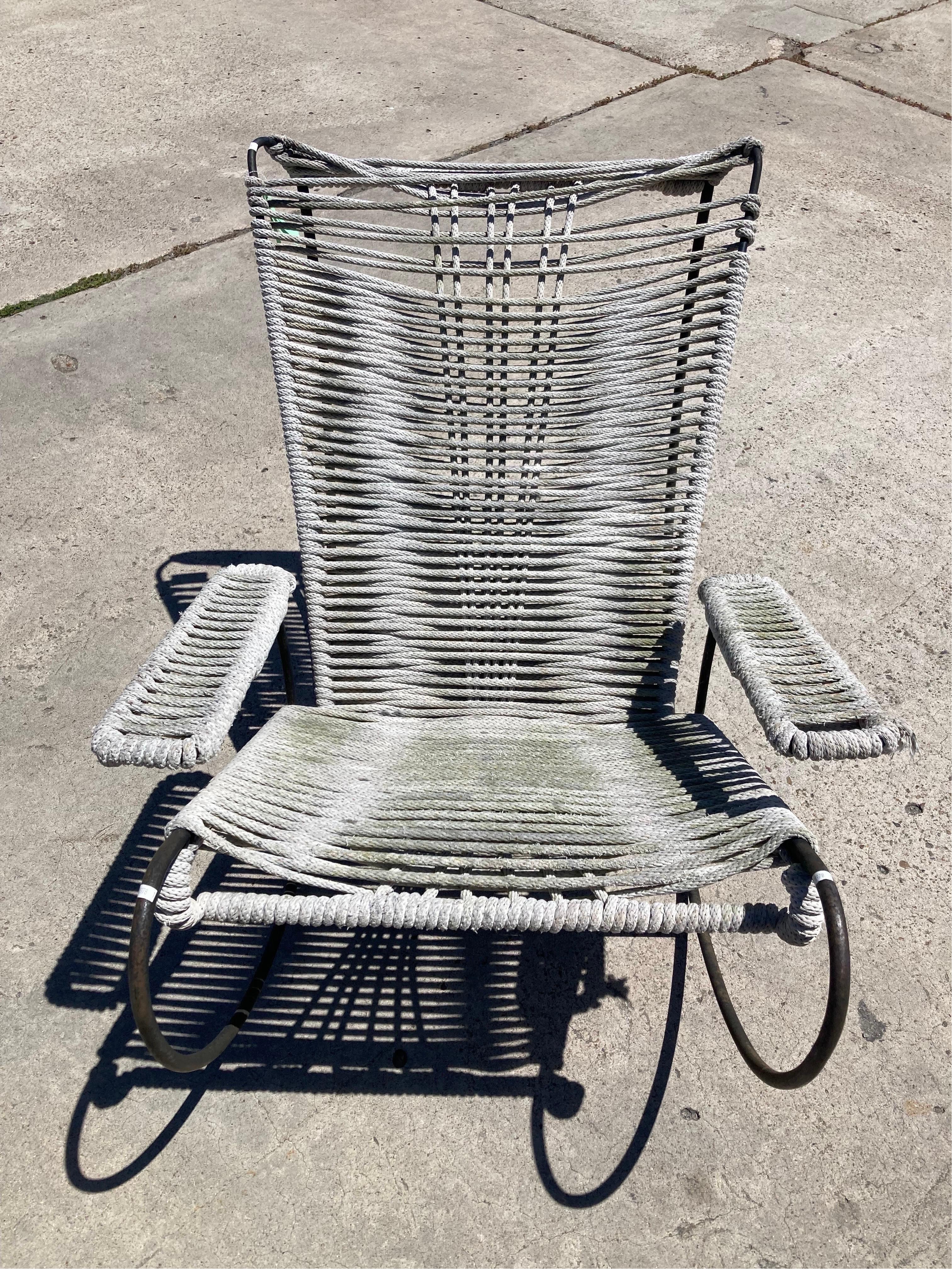 This Blackman Cruz Acapulco Rocker is an incredible example of modern design and is an extremely comfortable chair to relax in. The metal runners rock smoothly and the hand pulled rope gives the feeling of floating in mid-air. I have six available.