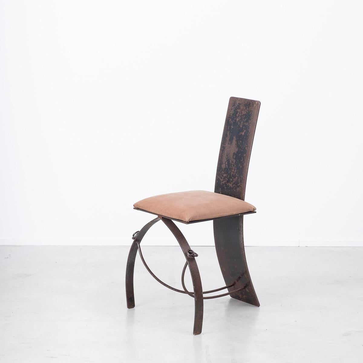 A rather unique chair crafted from steel plate sheeting and steel rod, with a upholstered leather seat. The backrest sweeps down to the floor also forming the back leg. Two curved legs splay outwards and are bound to the back legs with thin rods