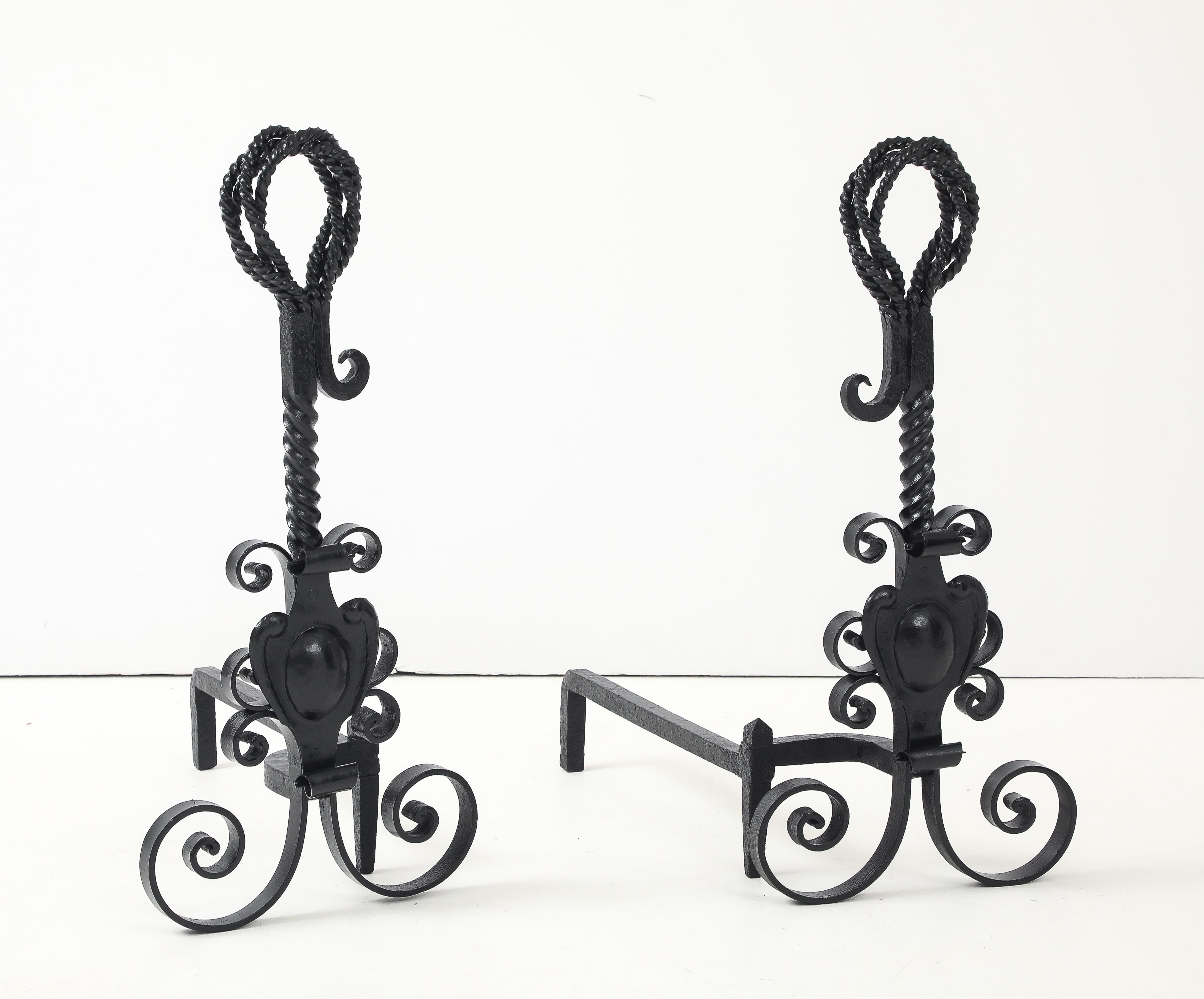 Pair of impressive size of hand made wrought iron andirons featuring twisted iron techniques.