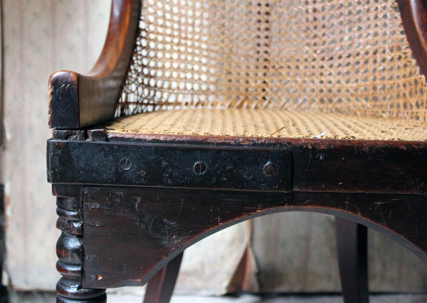 Early 19th Century Blacksmith Repaired Regency Mahogany Library Bergère Chair, circa 1815