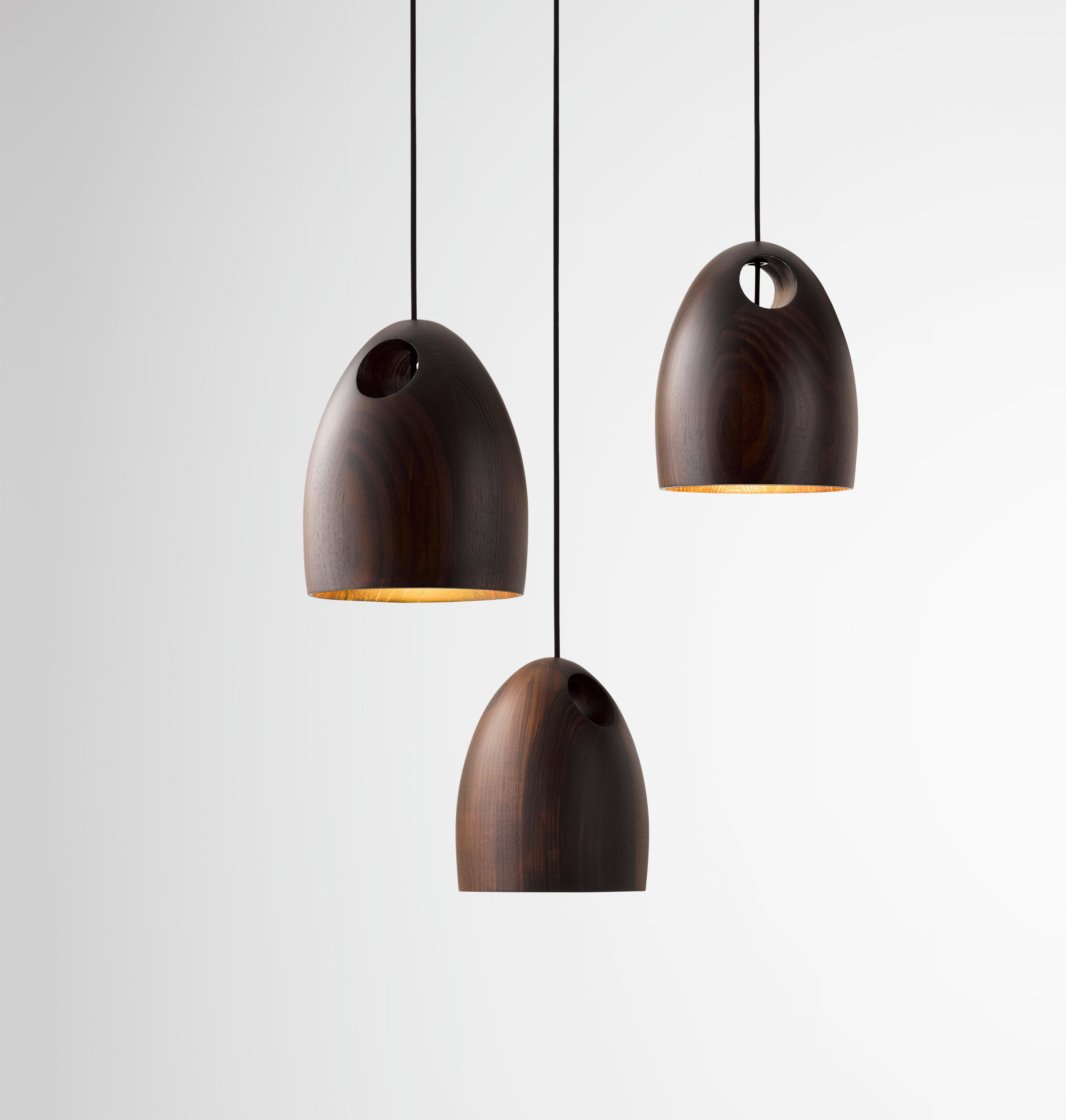 Oak is a sustainably sourced timber pendant light which emits a delicate luminance. Each Oak Pendant Light shade is hand crafted and defined by the grain of the timber selected. The body of the light is accentuated by the intersecting hole which