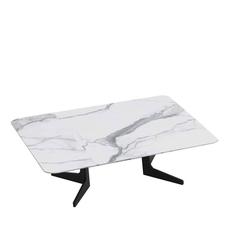 A testament of refined craftsmanship, this coffee table boasts an elegant allure. Composed of clean, essential lines, it features a metal base with a matte pewter finish with angled legs supporting a rectangular top superbly crafted of white