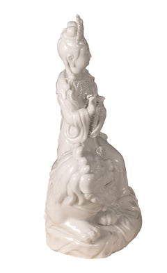 Blanc de Chine 'Dehua' Porcelain Figural Group of Quan Yin on Foo Dog or Temple