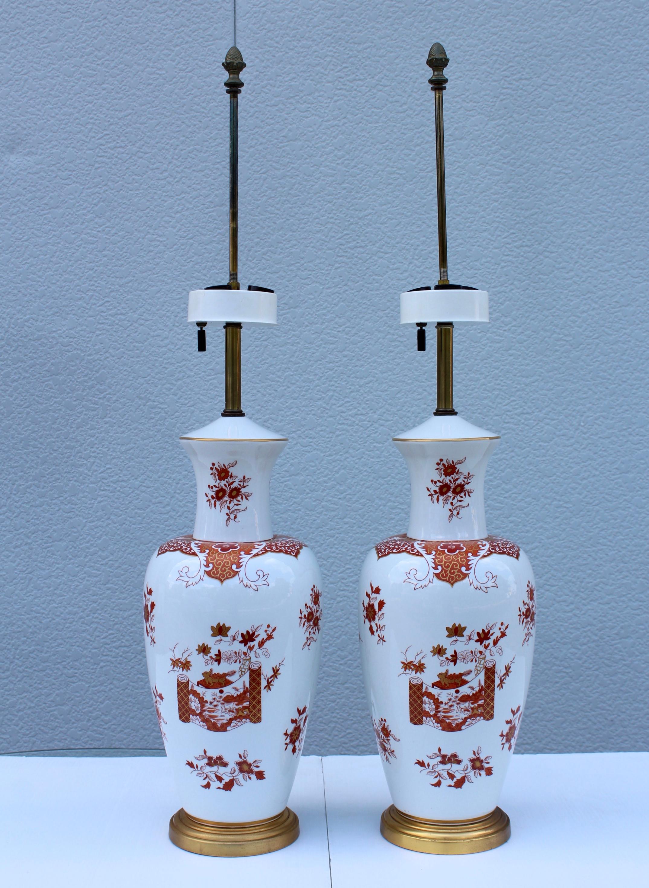 Stunning pair of 1950s Blanc De Chine porcelain large table lamps with hand painted detail and gilt base.

Shades for photography only.