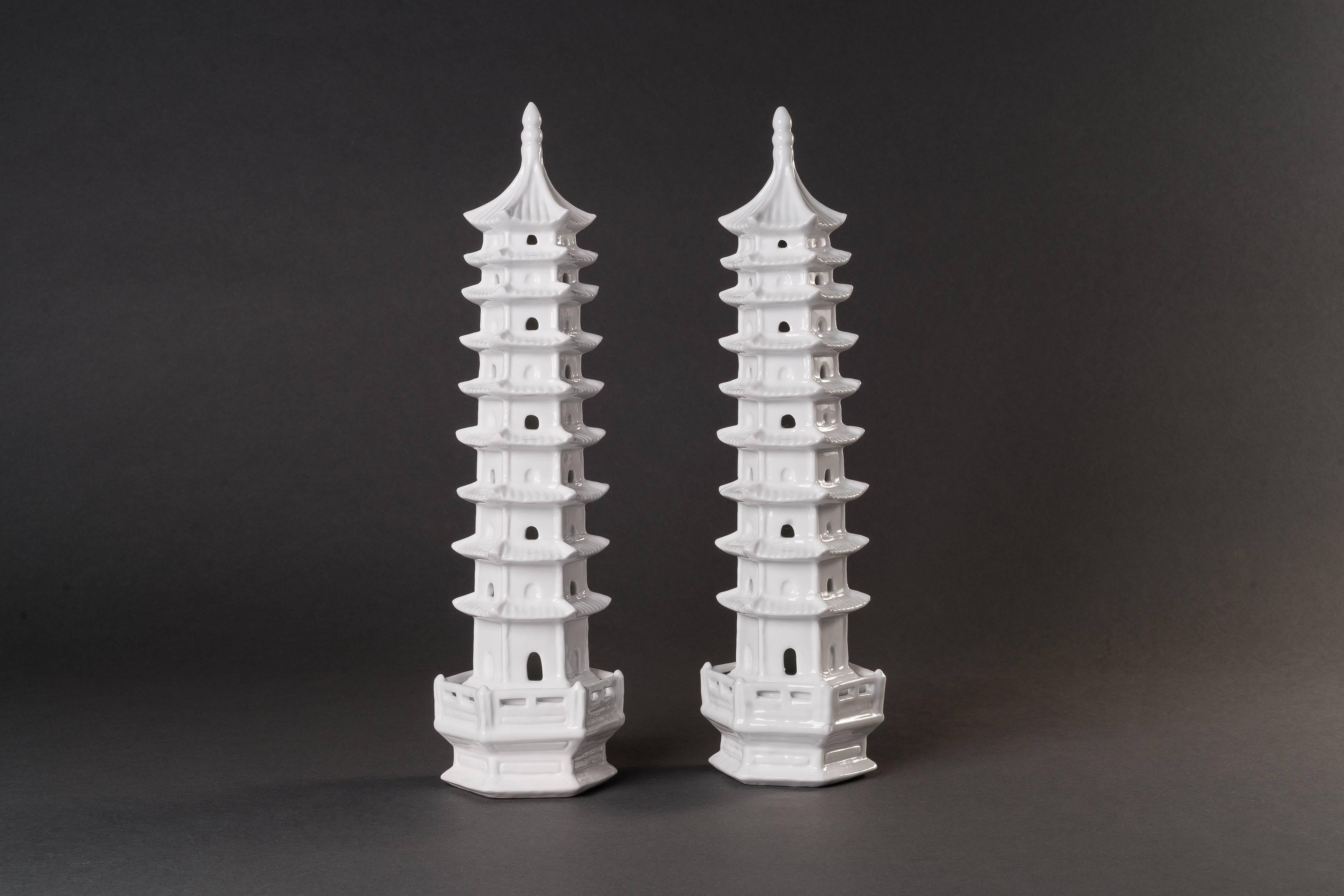 The set comprises of three pairs of white porcelain Blanc de Chine pagodas of different sizes and shapes.
Pagodas are a form of Buddhist architecture. Before Buddhism was introduced to China from India, there had been no pagodas in China. The