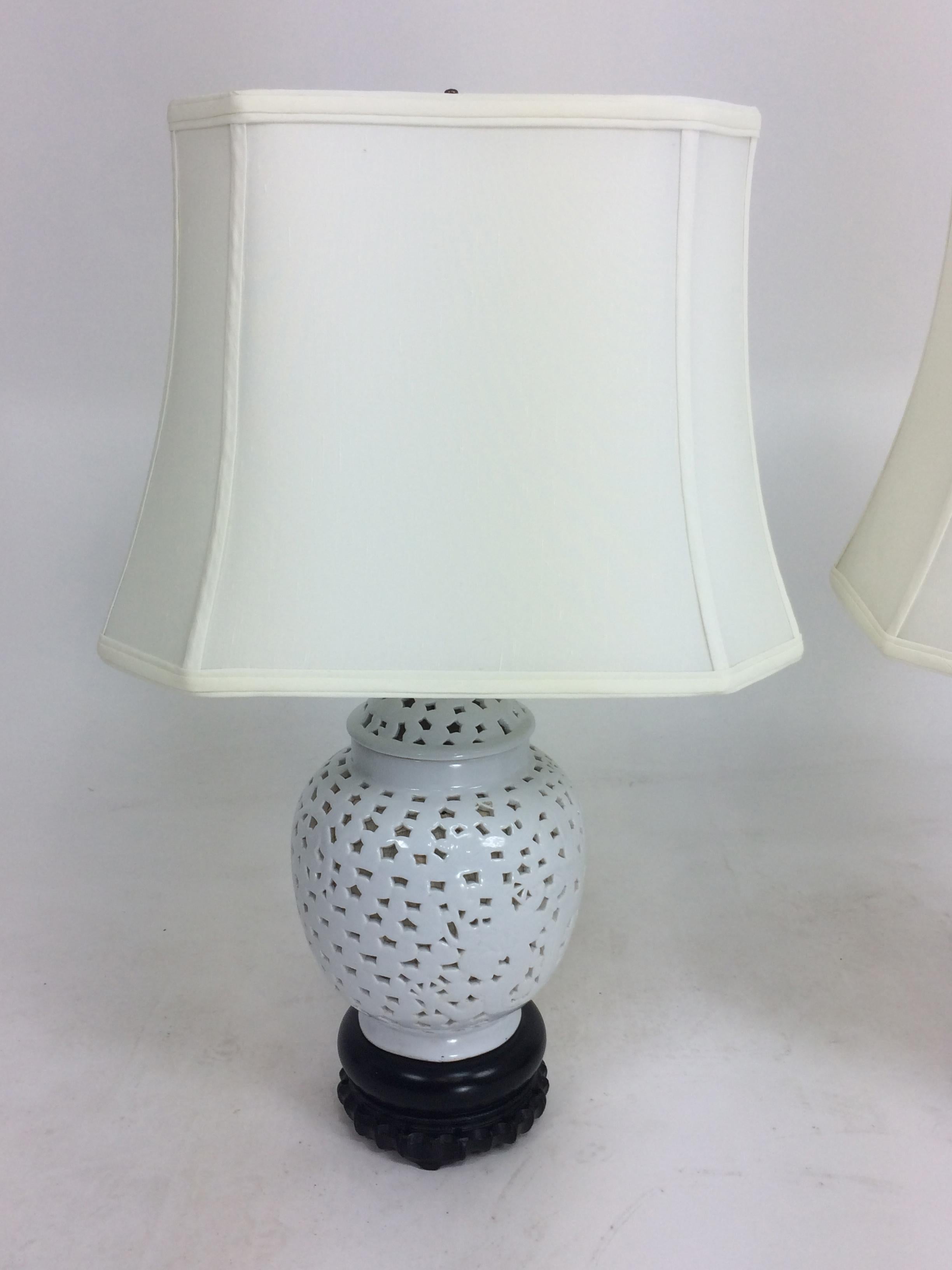 Pair of Blanc de Chine table lamps with shades. On wooden bases both in excellent original condition from the 1980s. 24.5 inches to top of shade 15