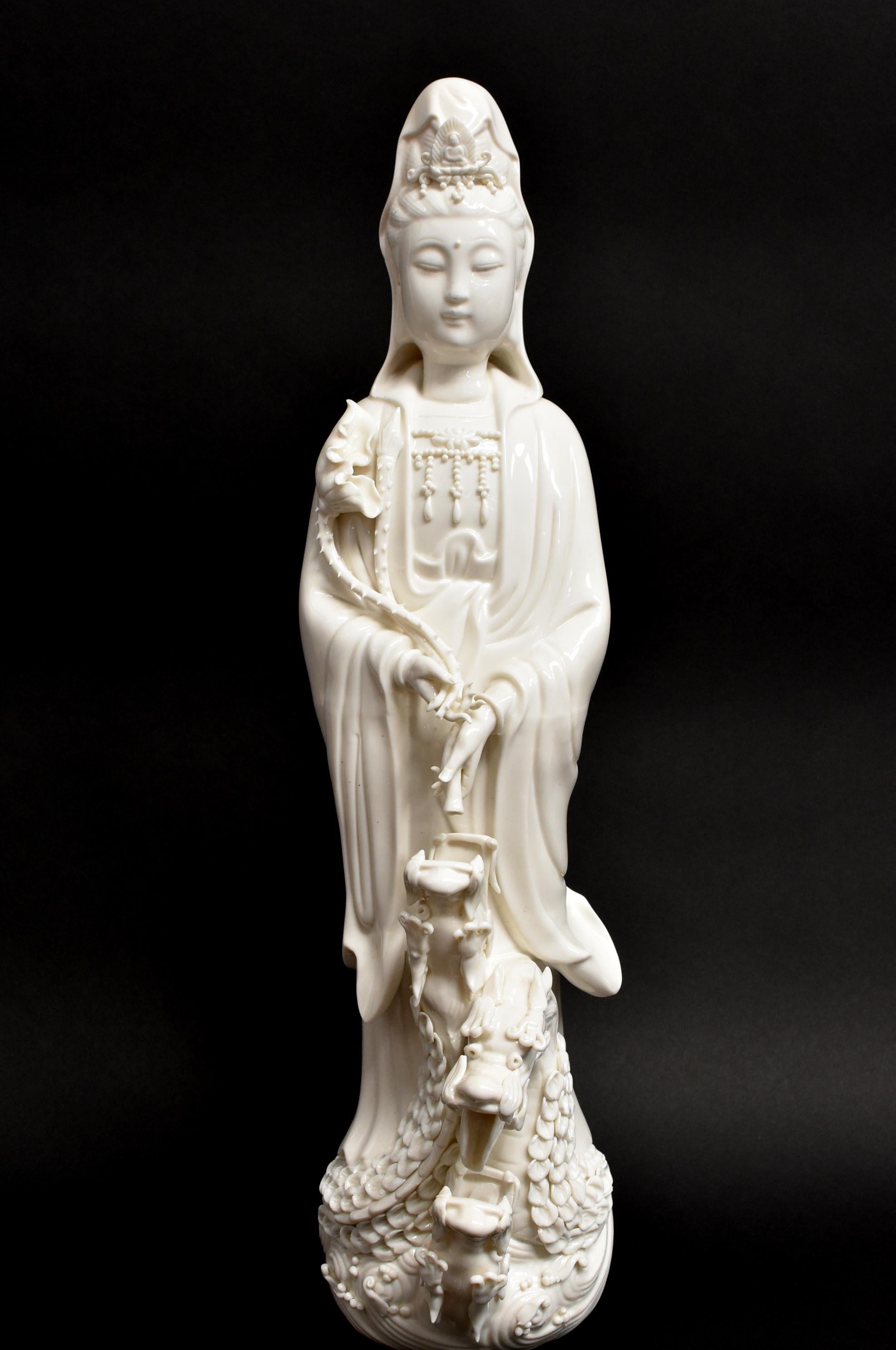 A fine De Hua porcelain sculpture that is also an amazing automatic water fountain. Add water through the mouth of the bottom dragon, turn the statue over and water will start dripping from Guan Yin's vase to each dragon's mouth. The ingenuous
