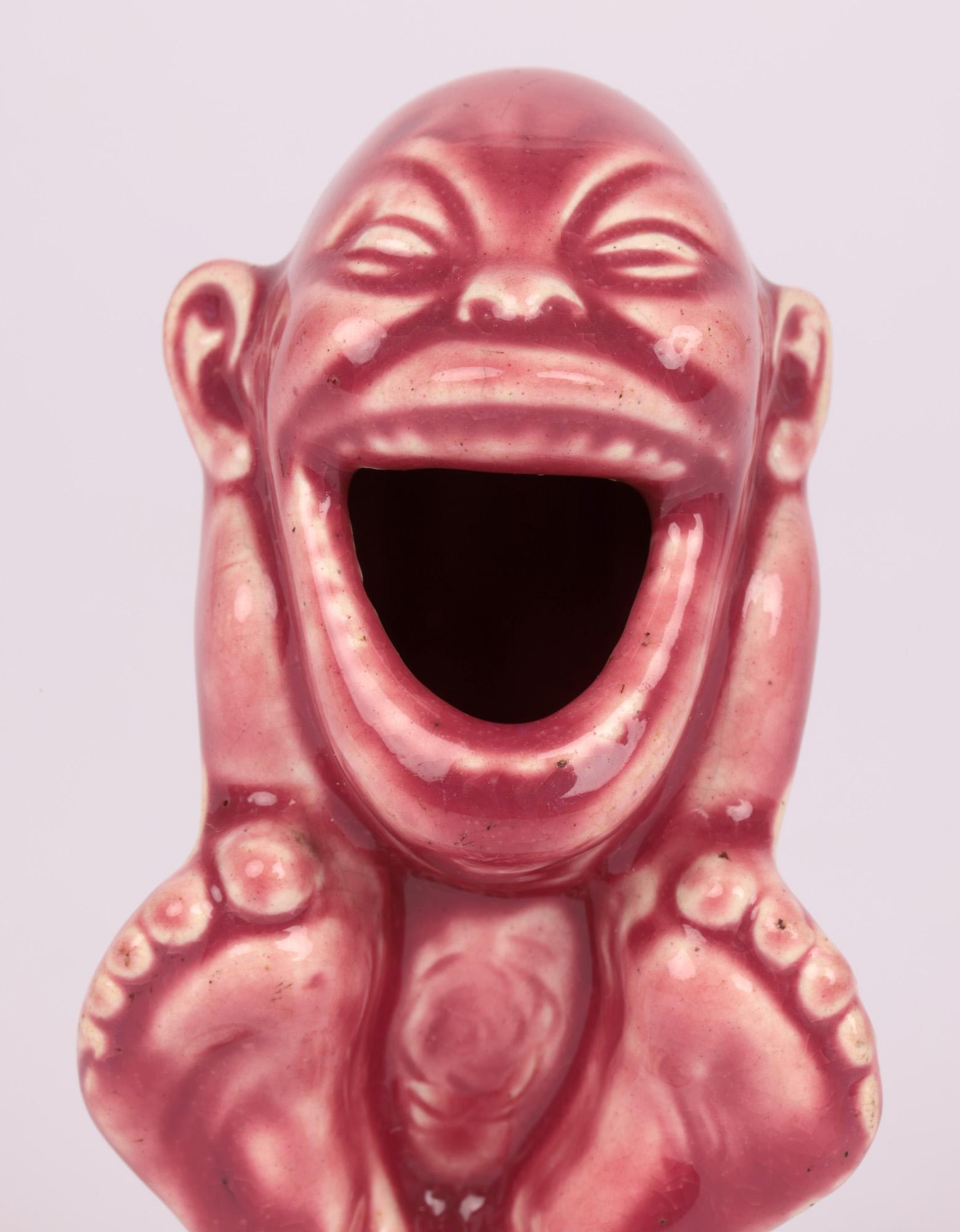 An unusual art Nouveau grotesque pottery figural match holder attributed to renowned ceramic artist Blanche Georgiana Vulliamy (British, 1869 - 1923) and dating from around 1905. The match holder is lightly potted as a hollow figure of a young naked