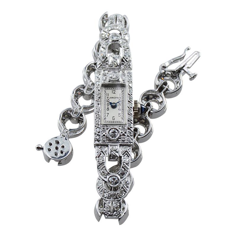 FACTORY / HOUSE: Blancpain
STYLE / REFERENCE: Art Deco / Dress Watch
METAL / MATERIAL: Platinum + 18KT Diamonds
CIRCA / YEAR: 1930 - 1940
DIMENSIONS / SIZE: 23mm x 10mm
MOVEMENT / CALIBER: Manual Winding / 17 Jewels 
DIAL / HANDS: Silvered with