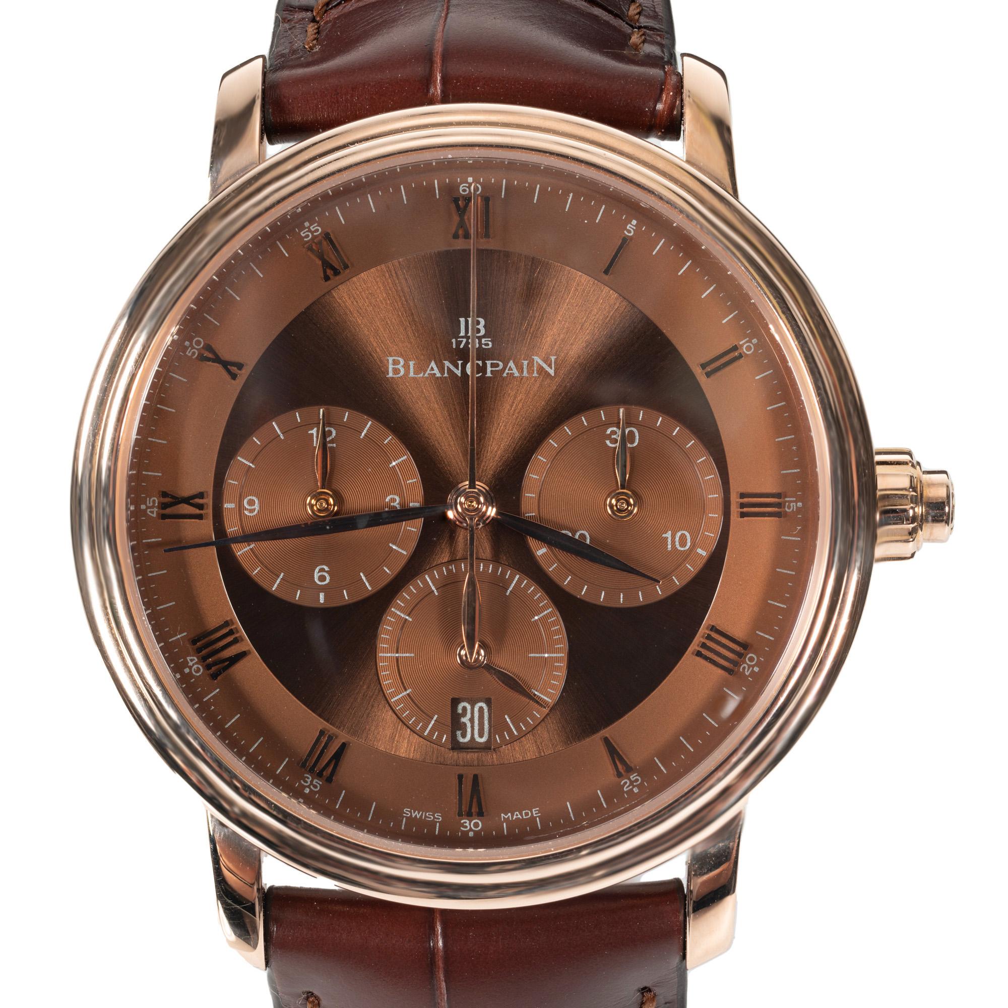 The Blancpain Villeret automatic 18 rose gold single button chronograph is a masterpiece of refined elegance and meticulous craftsmanship. This timepiece is carved from luxurious rose gold, exuding a warm, sophisticated glow that complements its