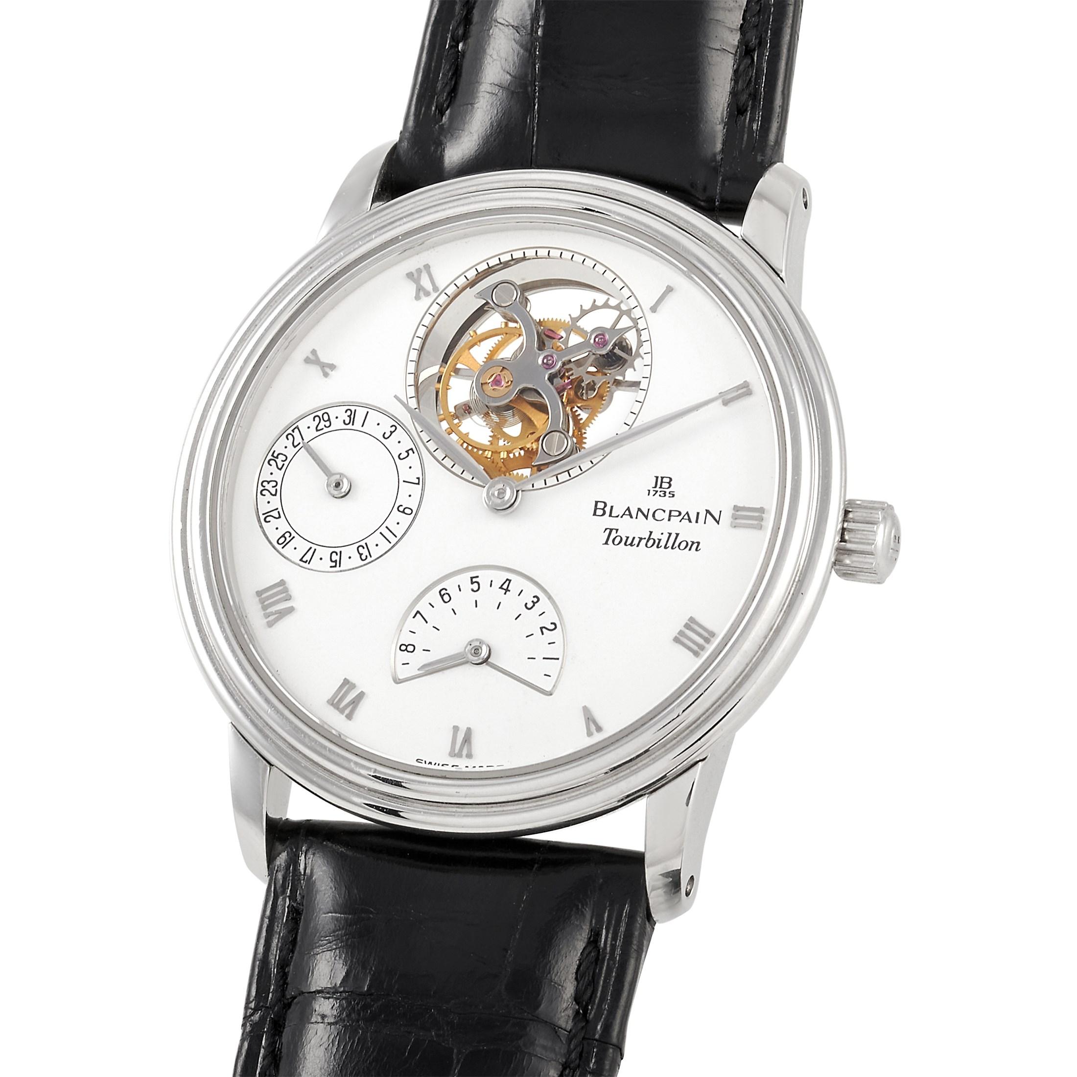 This BlancPain Villeret Tourbillon Watch, reference number 0023-3427-58, features a fine platinum case that measures 34 mm in diameter. The case is presented on a black leather strap with tang closure. The open case back offers a glimpse into the