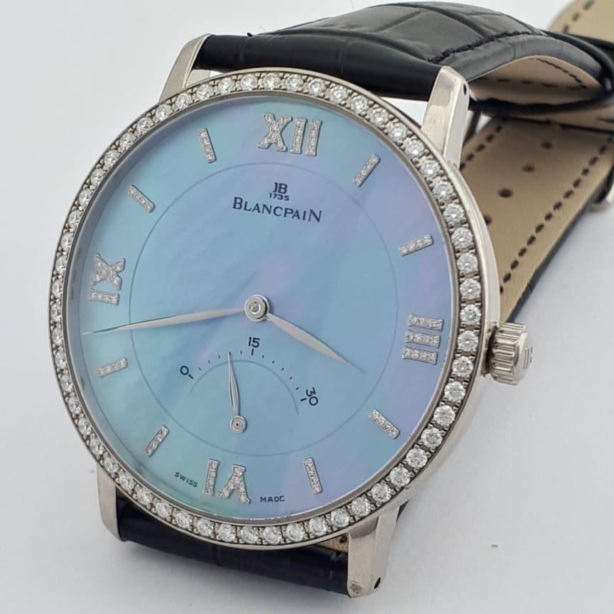 **** Automatic, 18 Kt White Gold, Diamond Bezel & Indexes, 40mm MoP Dial, Retrograde Seconds

Brand: Blancpain (Guaranteed Authentic)
Model: Villeret Ultra-Slim
Reference Number: 4063-1961-55
Gender: Men's /Unisex
Metal: 18Kt White Gold
Case Size: