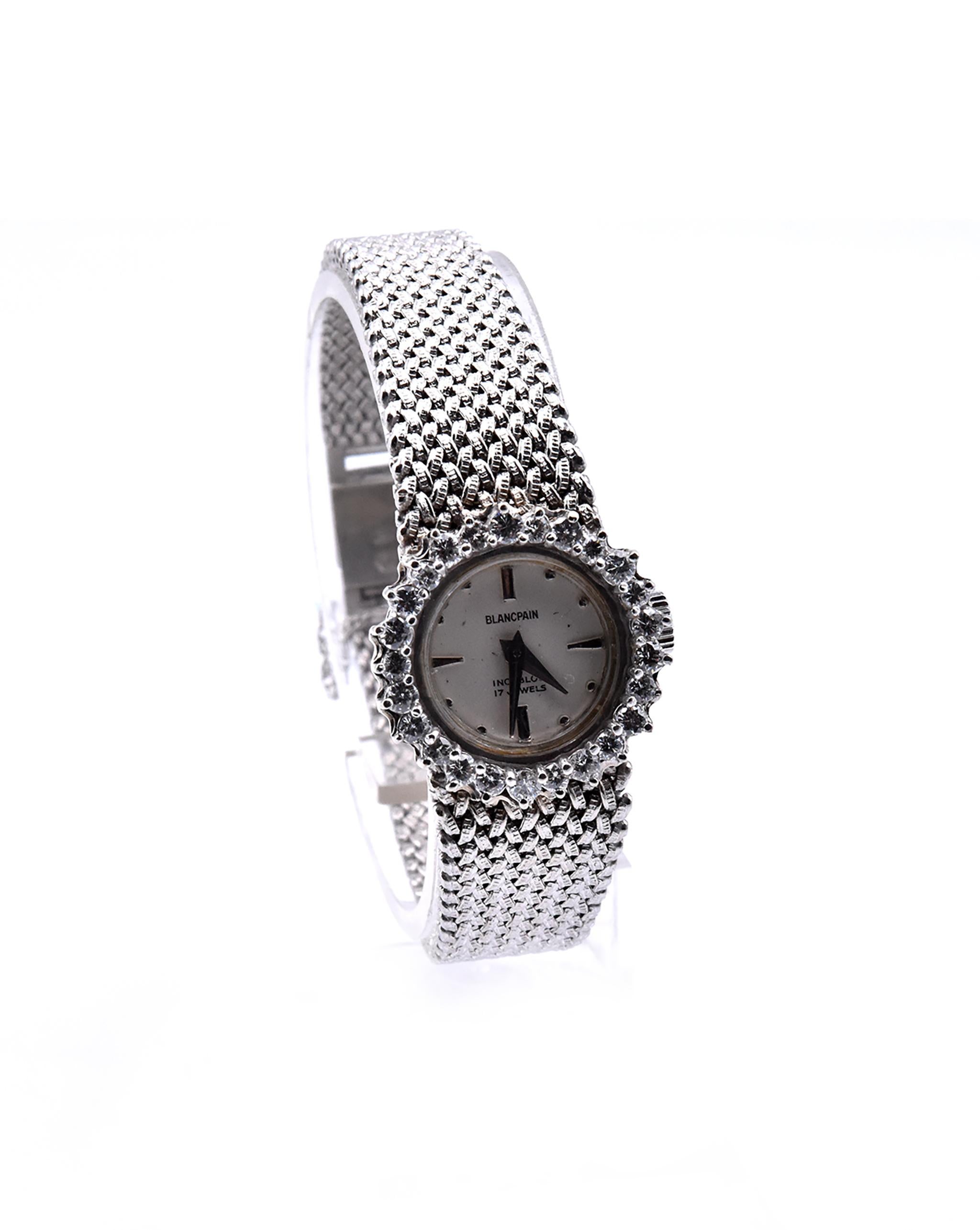 Movement: quartz
Function: hours, minutes
Case: 20mm round 14K white gold case, .60cttw diamond bezel, push pull crown
Band: 18K white gold mesh style bracelet with safety clasp
Dial: white dial with silver sticks
Serial #: Case Serial
