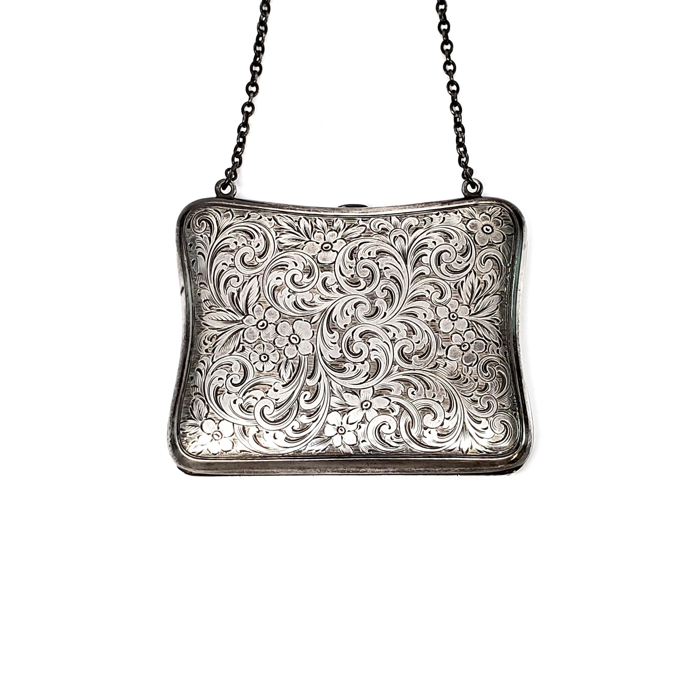Antique sterling silver coin purse by R. Blankinton & Co.

Floral and flourish engraved design with AHC monogram on one side. Round link chain strap and interior pockets on each side. Circa 1900-1909.

Size: 3 5/8