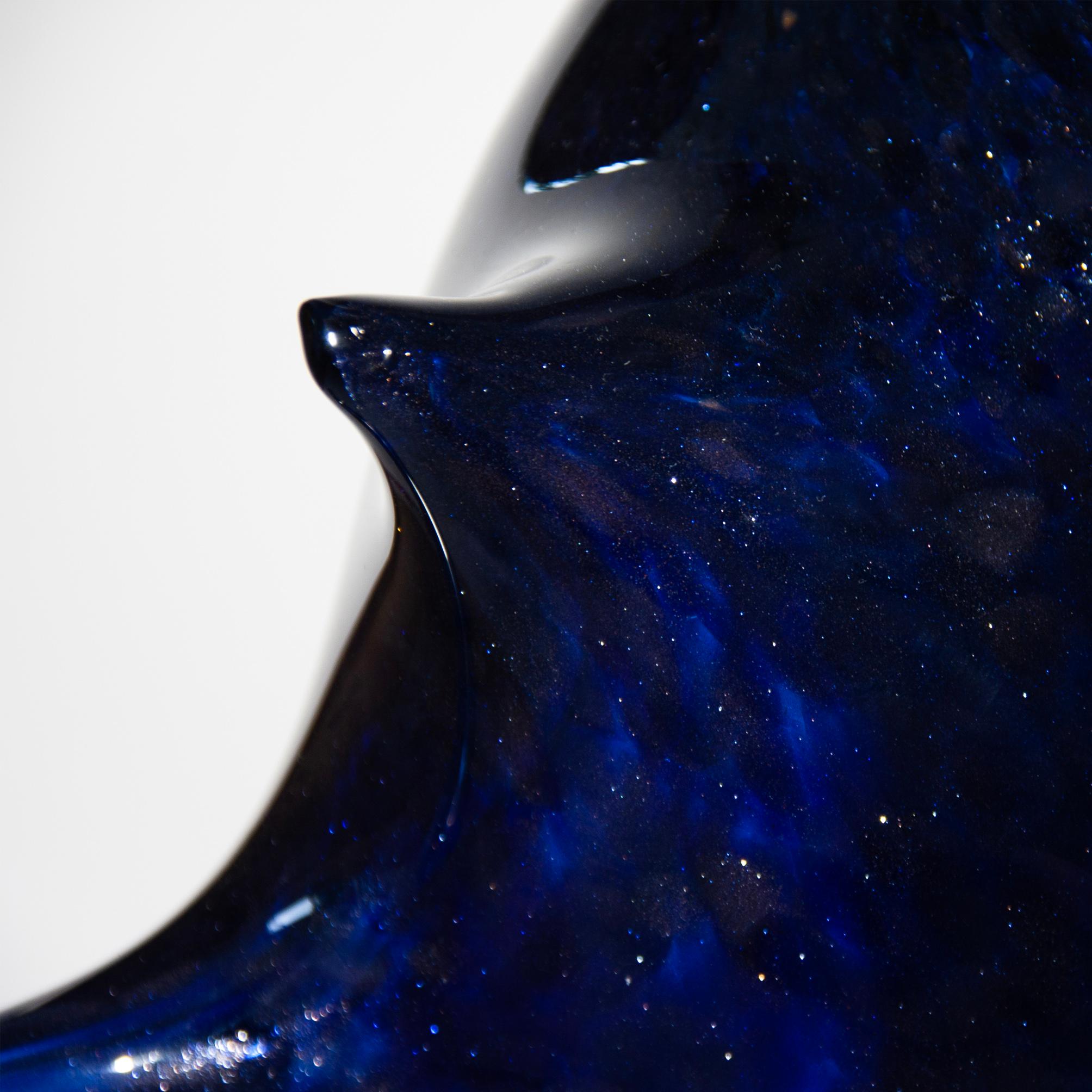 The spectacular Veloce vase is a one-of-a-kind sculpture from the Blast collection, available in fabulous Blue Avventurina glass. Design and technical experimentation, for Ermes, is the only possible way to express its visionary ideas. Blast is a