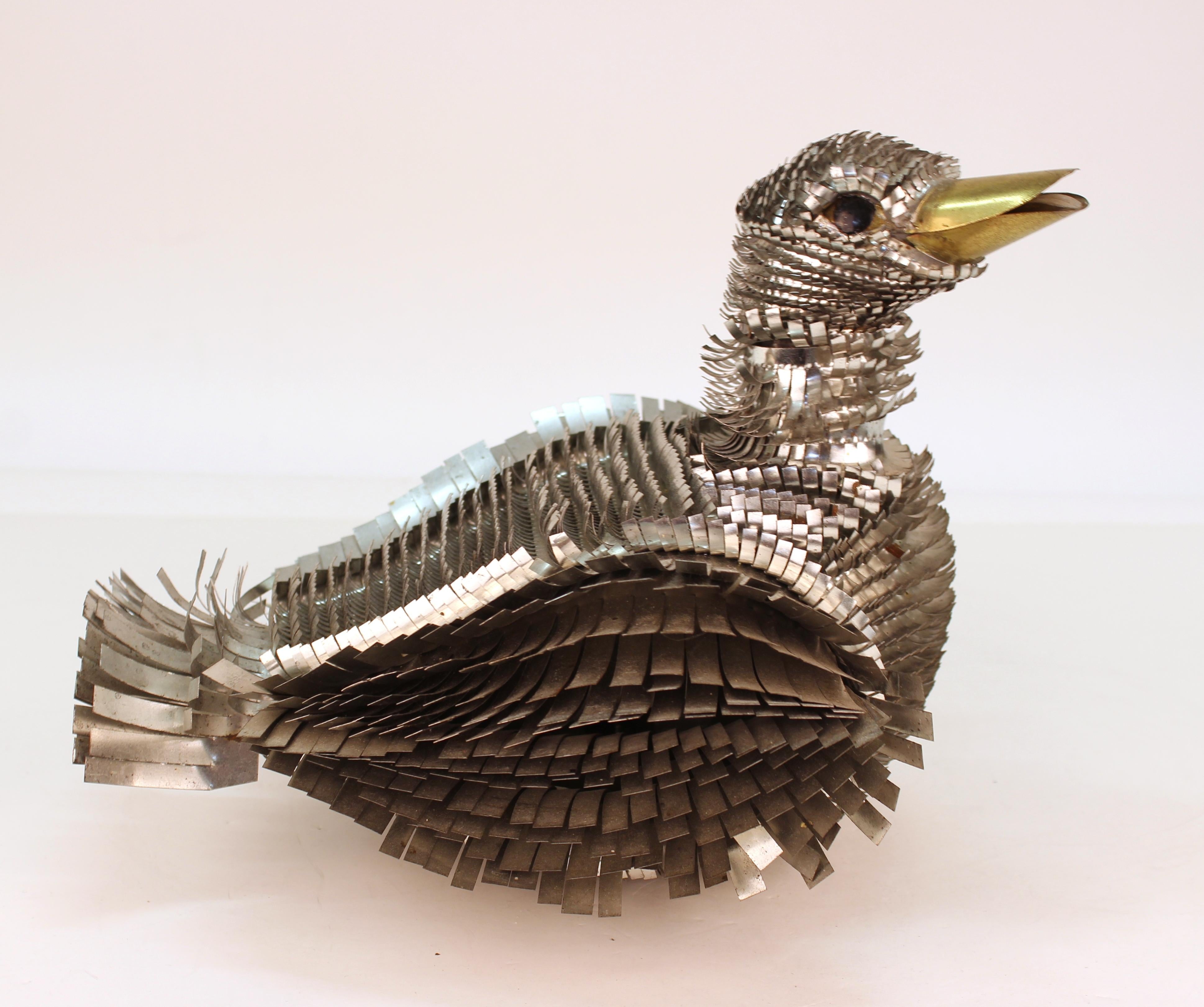 Mid-Century Modern duck sculpture made in metal by A. Blazquez. The piece was created in Mexico in the mid-20th century and is in great vintage shape. The duck appears to have had legs originally.
