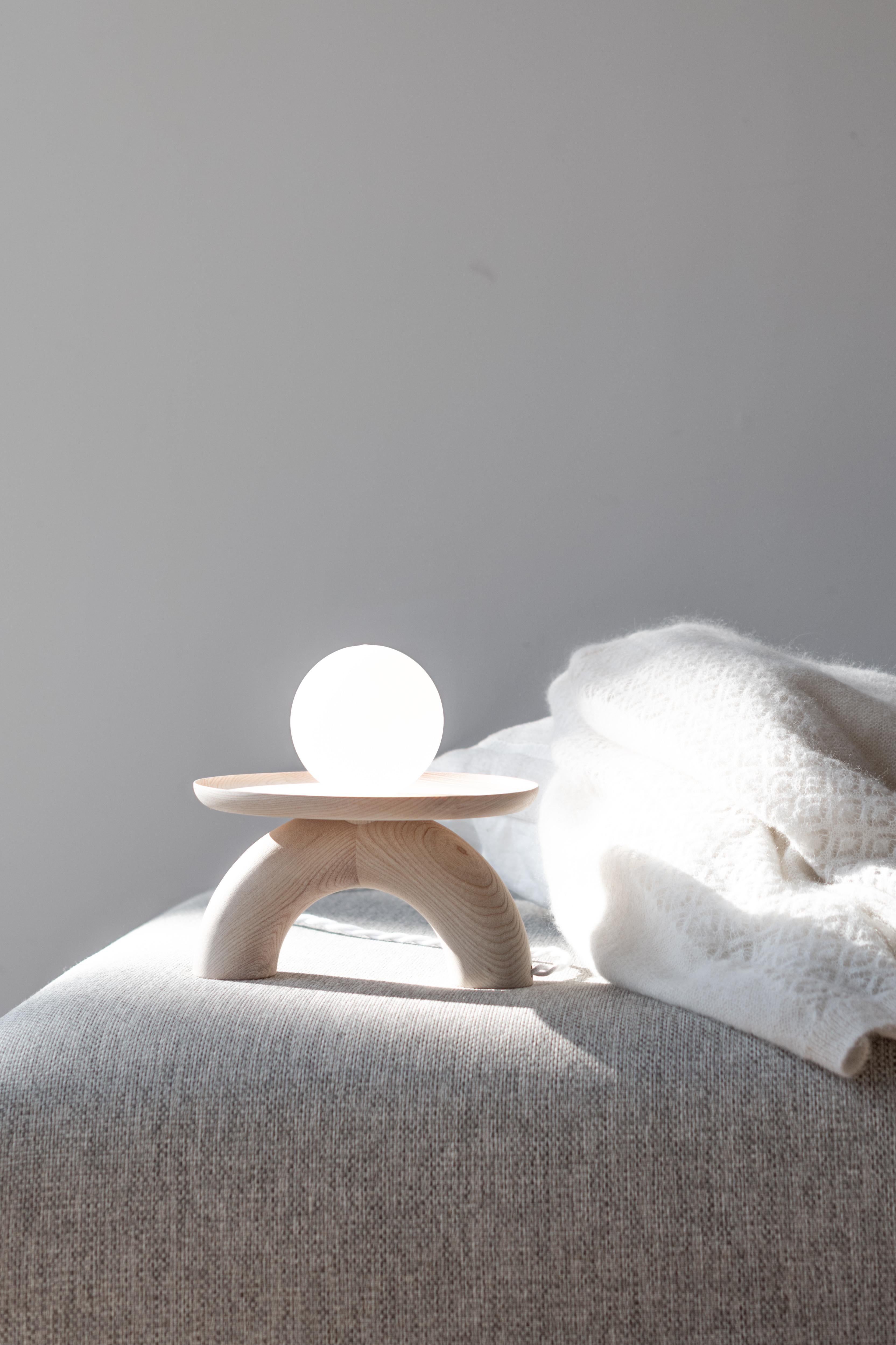 Bleached Ash Popylight Lamp by Mademoiselle Jo
Dimensions: Ø 23 x H 23.5 cm.
Materials: Bleached ash wood and opaline glass.

Two wood colors available: Bleached ash and black stained ash. Please contact us.

Small curved tray, composed of an arched