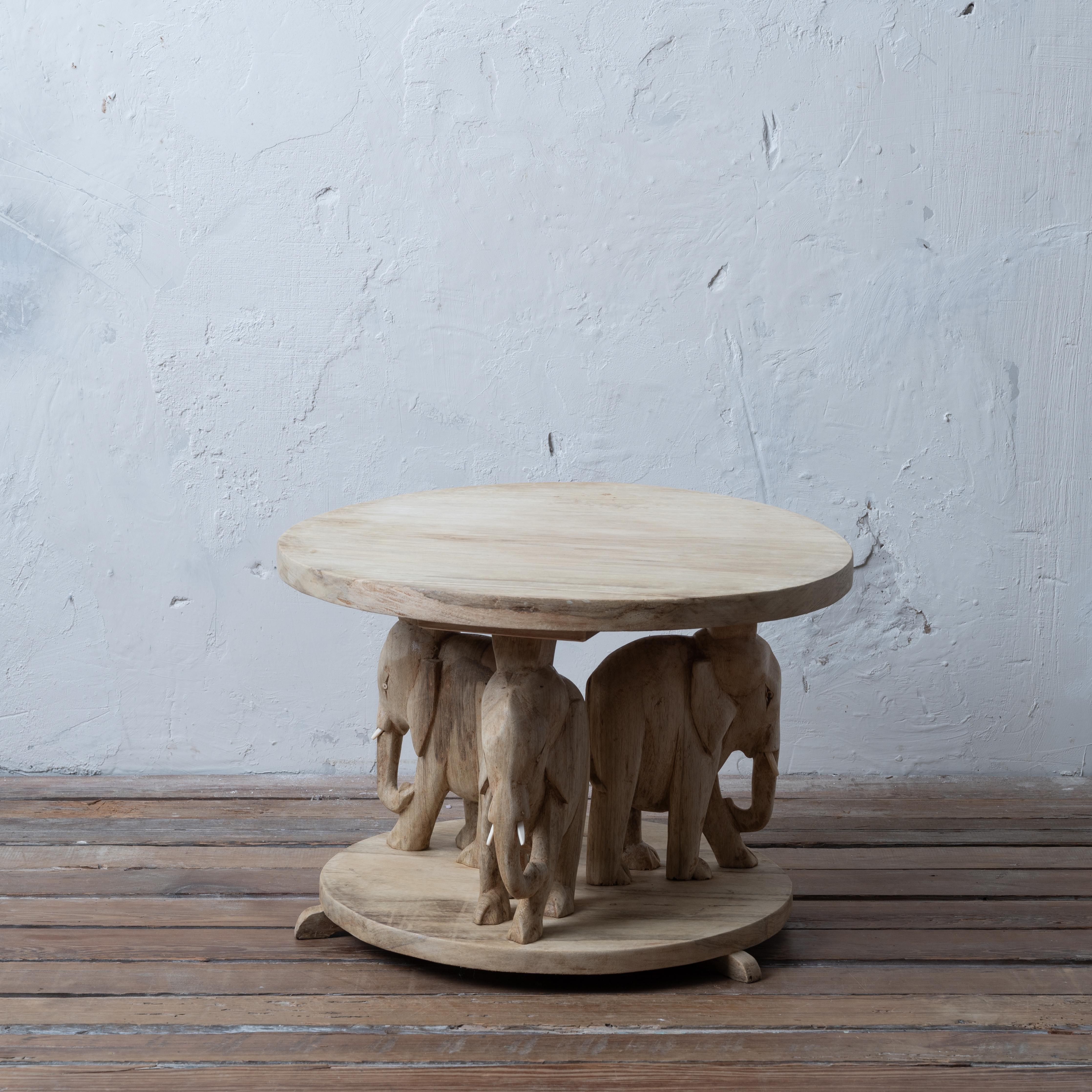 A bleached African Ashanti carved elephant coffee table, 1960s.

21 inches wide by 20 inches deep by 14 ¾ inches tall

