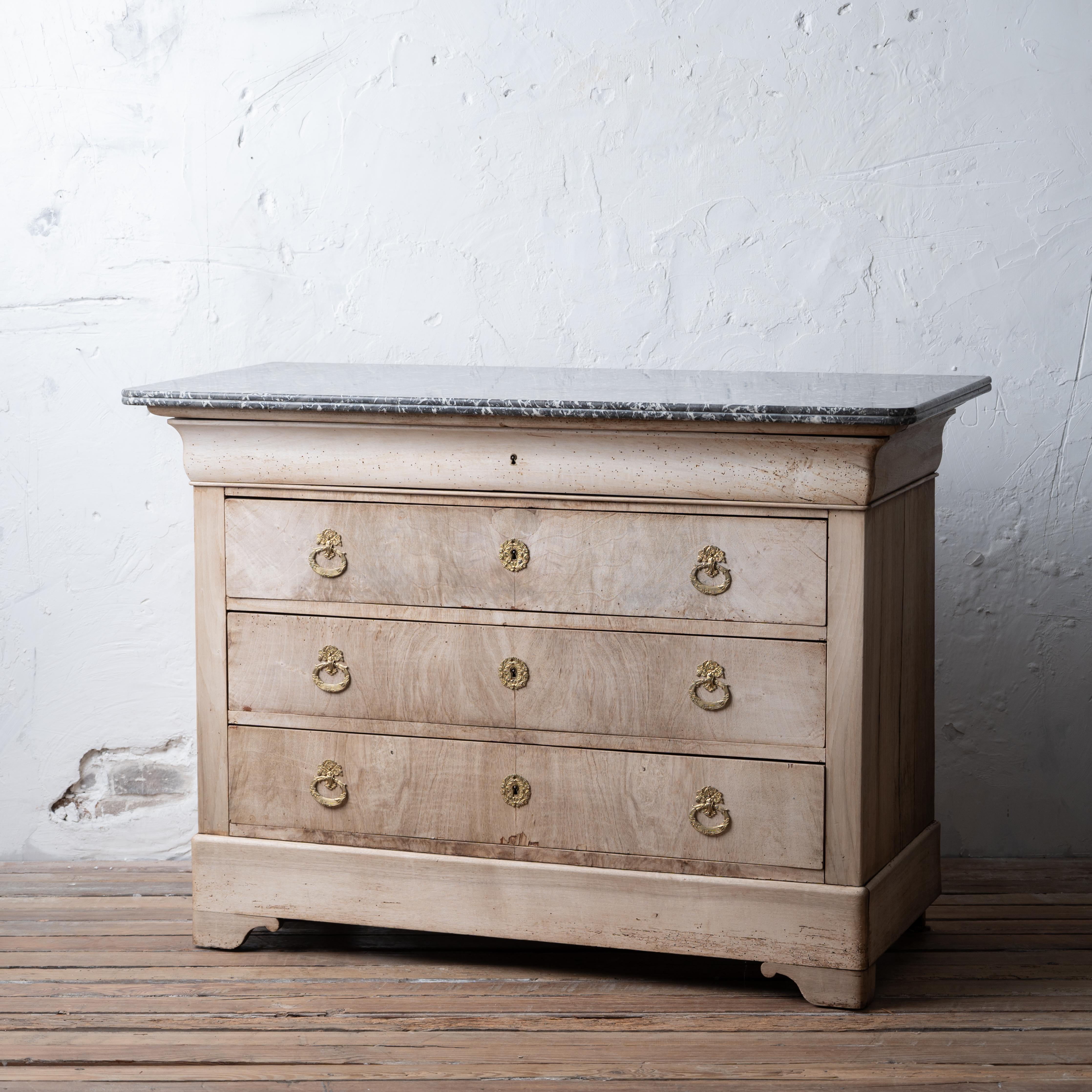 A bleached marble top Louis Phillipe commode, circa 1860.



51 ¾ inches wide by 24 inches deep by 37 inches tall





