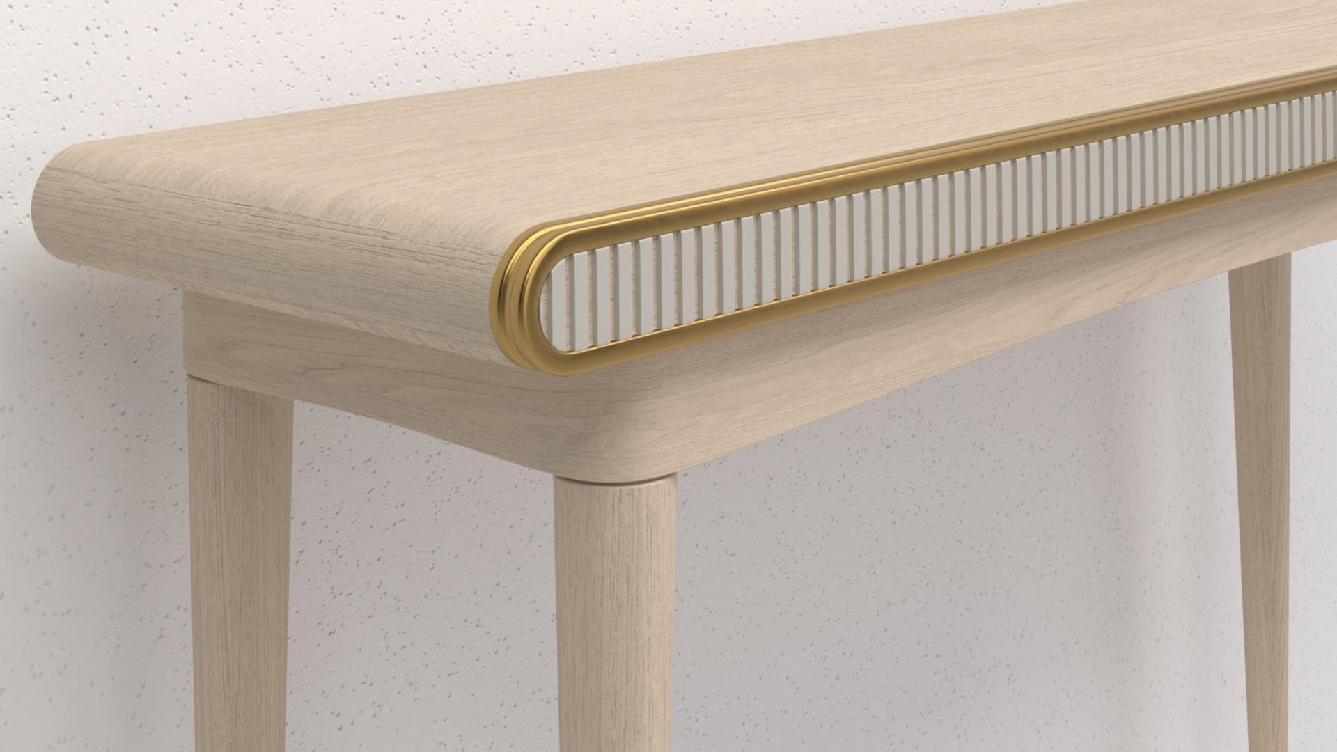 A variation of our blackened oak console. This Gaia console has a hand applied bleached oak frame, hand machined bone Corian detailing and infuses both liquid and solid brass details including solid brass 
