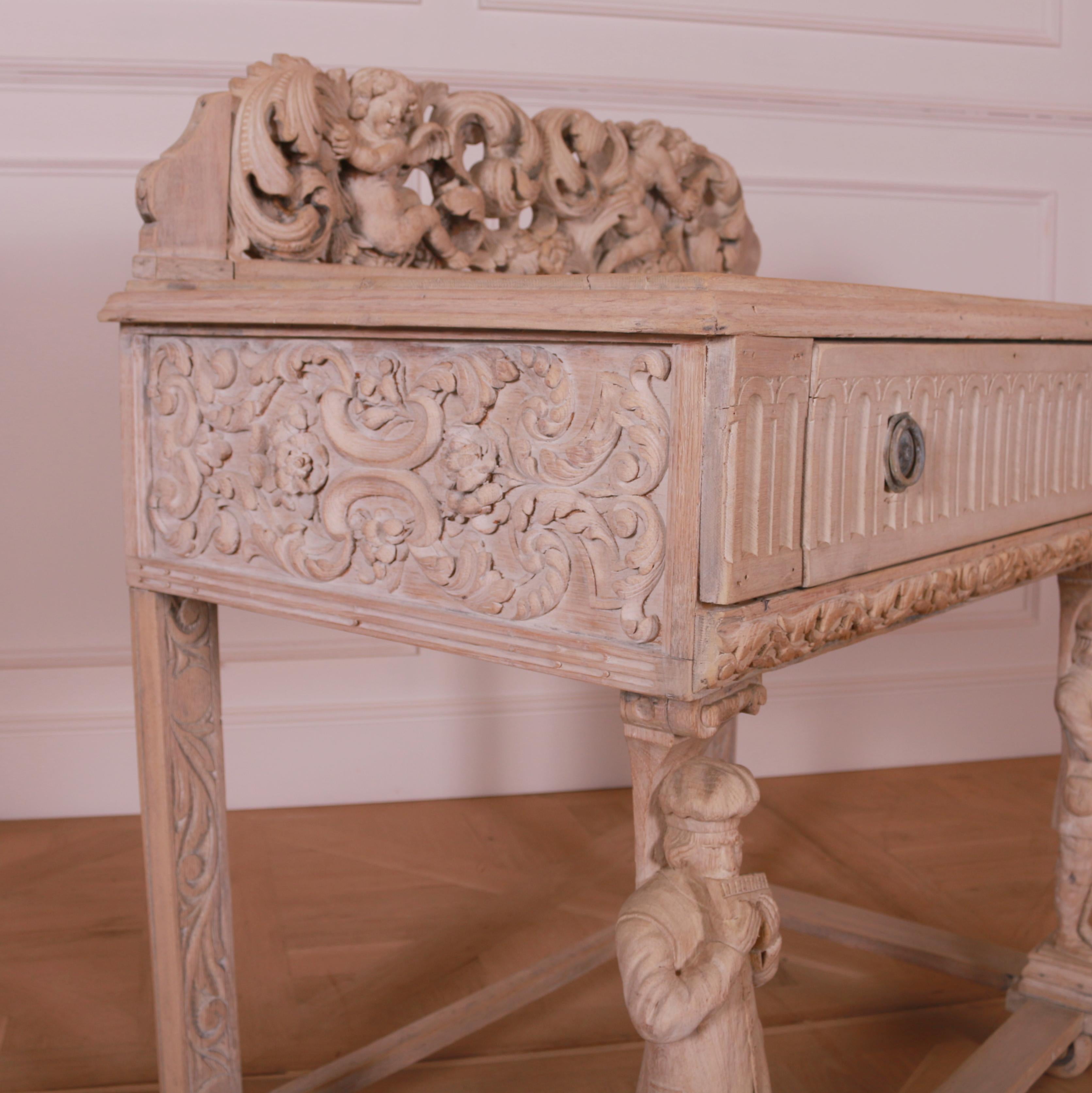 Early 19th C Northern European bleached oak carved one drawer side table. 1830.

Height to worktop is 31