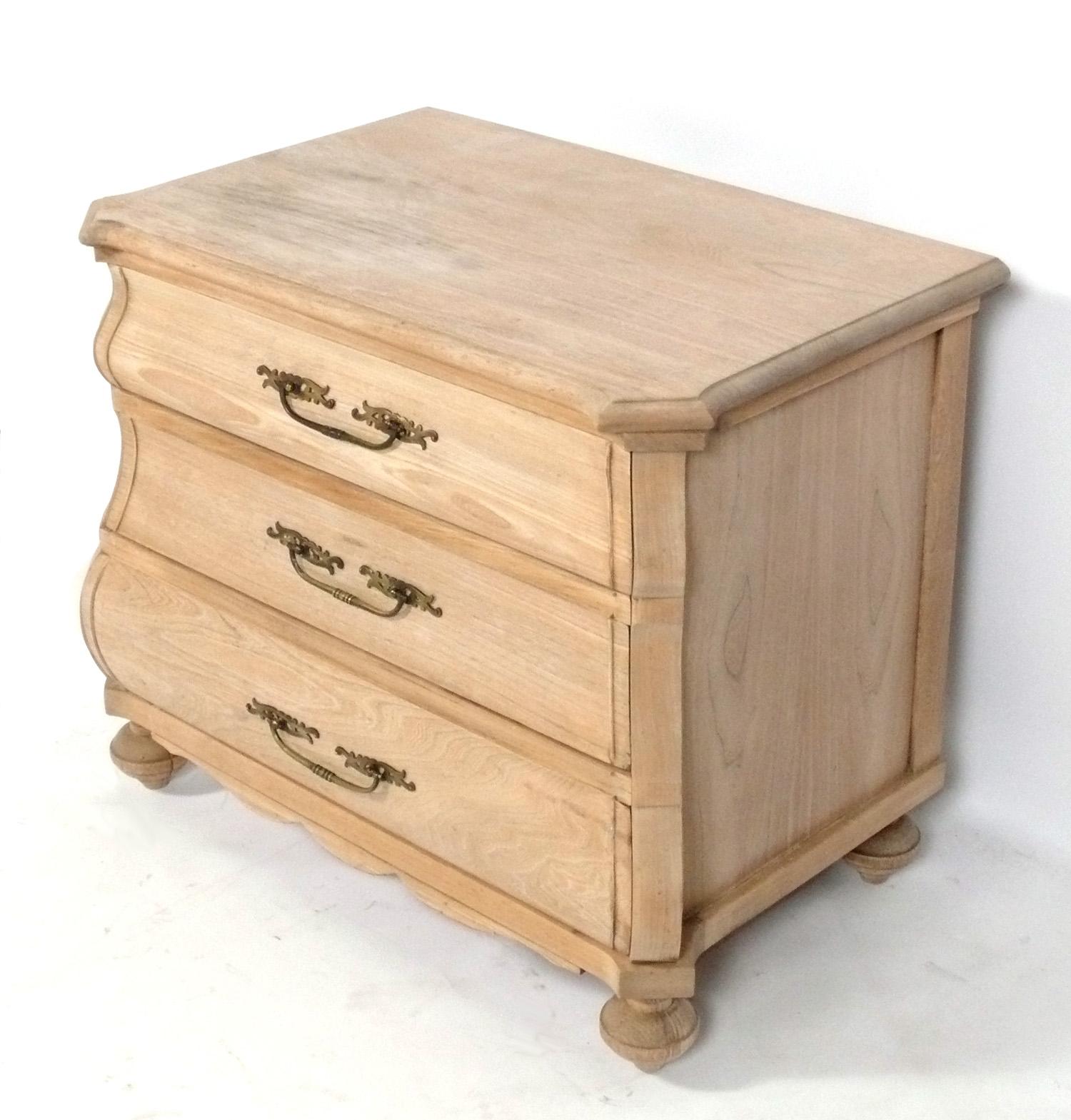Bleached Oak French Serpentine Chest, France, circa 1950s. Elegant serpentine design features three wide deep drawers for all your storage needs. It is a versatile size and can be used as a side or end table or storage piece in a living area, or as