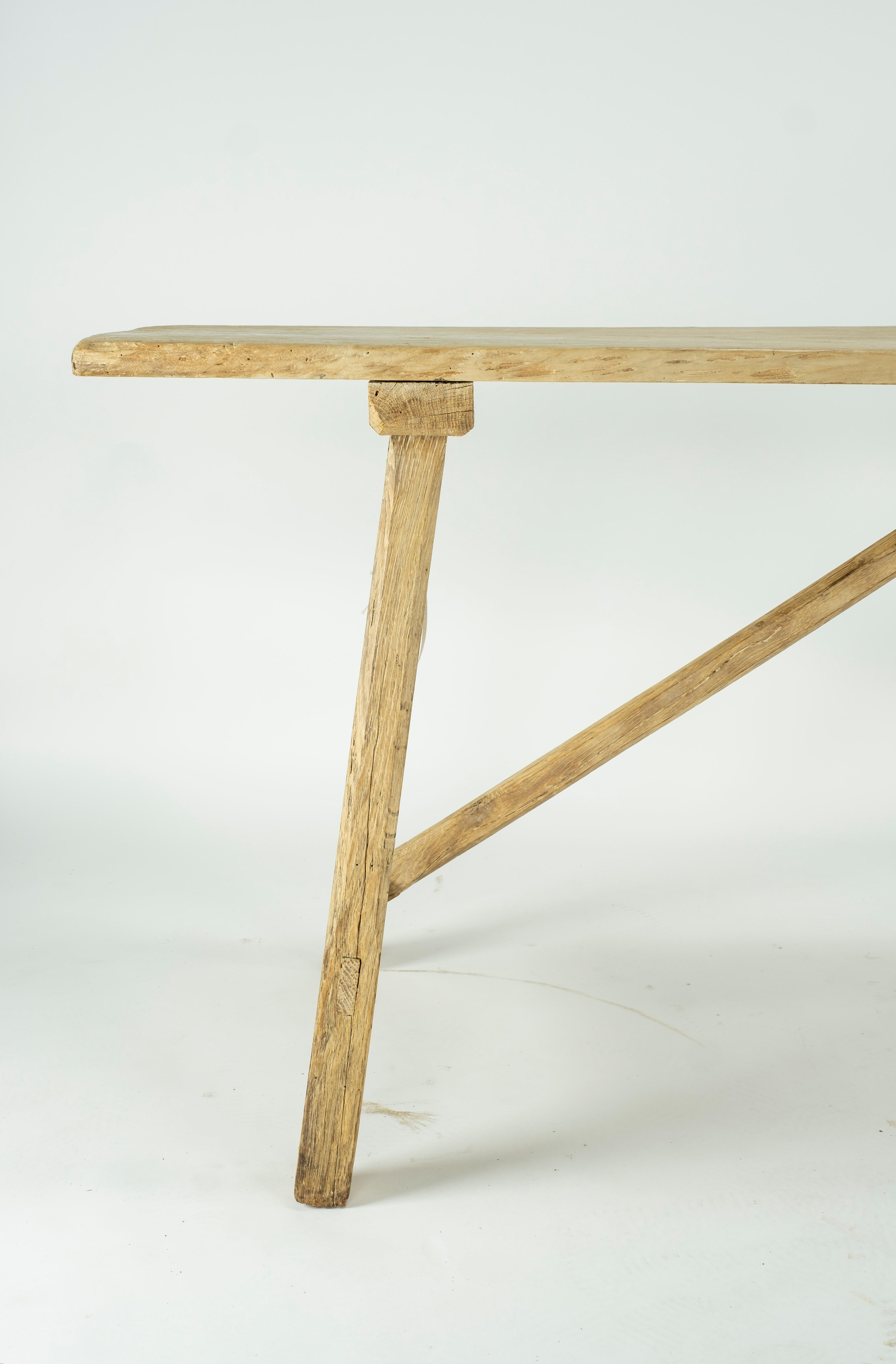Bleached oak Spanish console table on a single plank top.