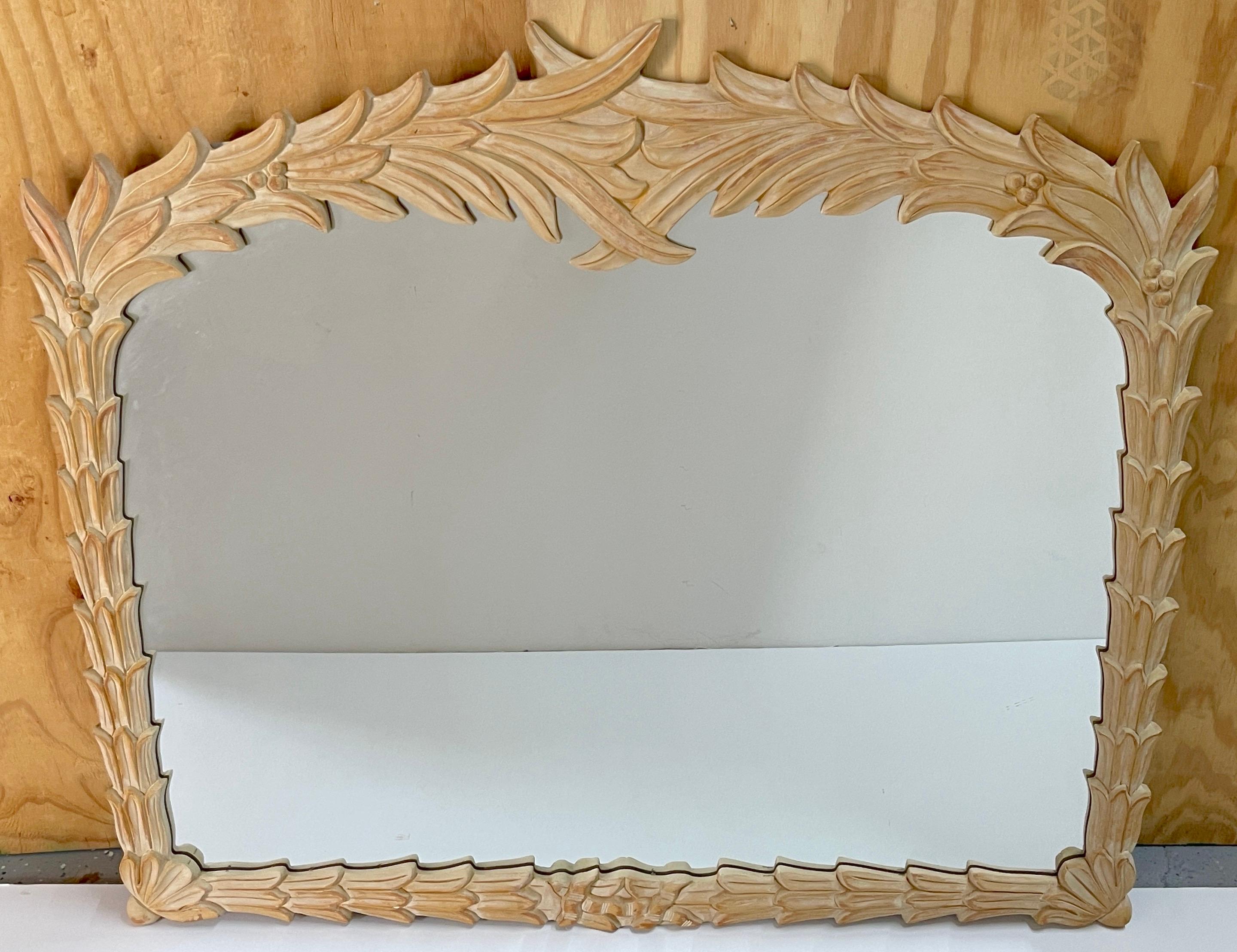Bleached Palmette Rectangular Mirror, in the Style of Serge Roche 
USA, circa 1980s

Of rectangular form, with a continuous surround of overlapping palm leaves, with an 42-inch wide x 30-Inch high mirror.