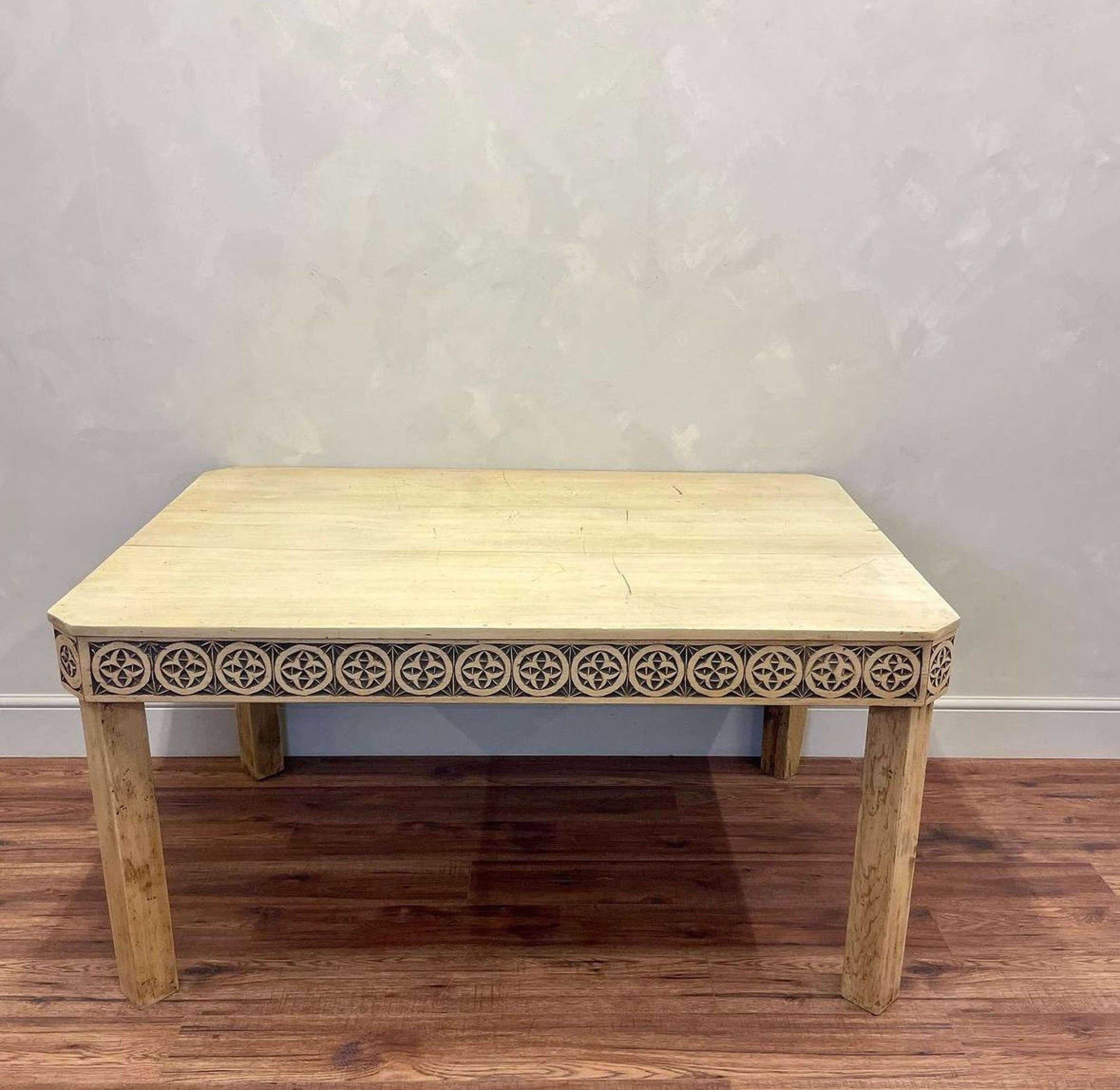 Large Bleached Pine Carved Table
With a hand carved Celtic style frieze rail. The chamfered corner detail brings something special to this piece.

England, circa 1900.

Could be used as a dining table.

Measuring at:
Length: 149.5cm (4ft 11”)
Depth: