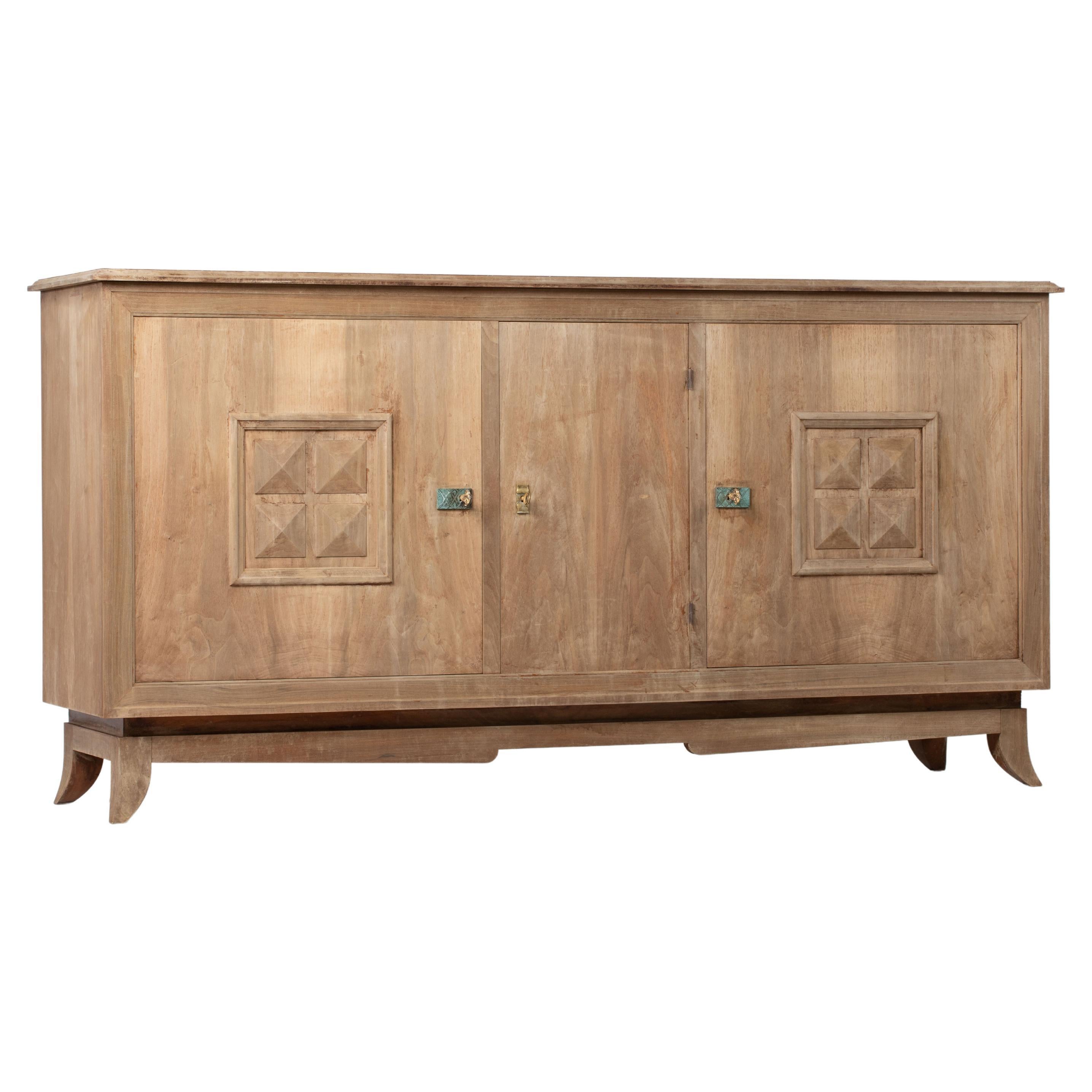 Bleached solid oak credenza, France, 1940s.
Large mid-century Brutalist sideboard. 
The credenza consists of three central storage facilities and covered with very detailed designed doors. 


