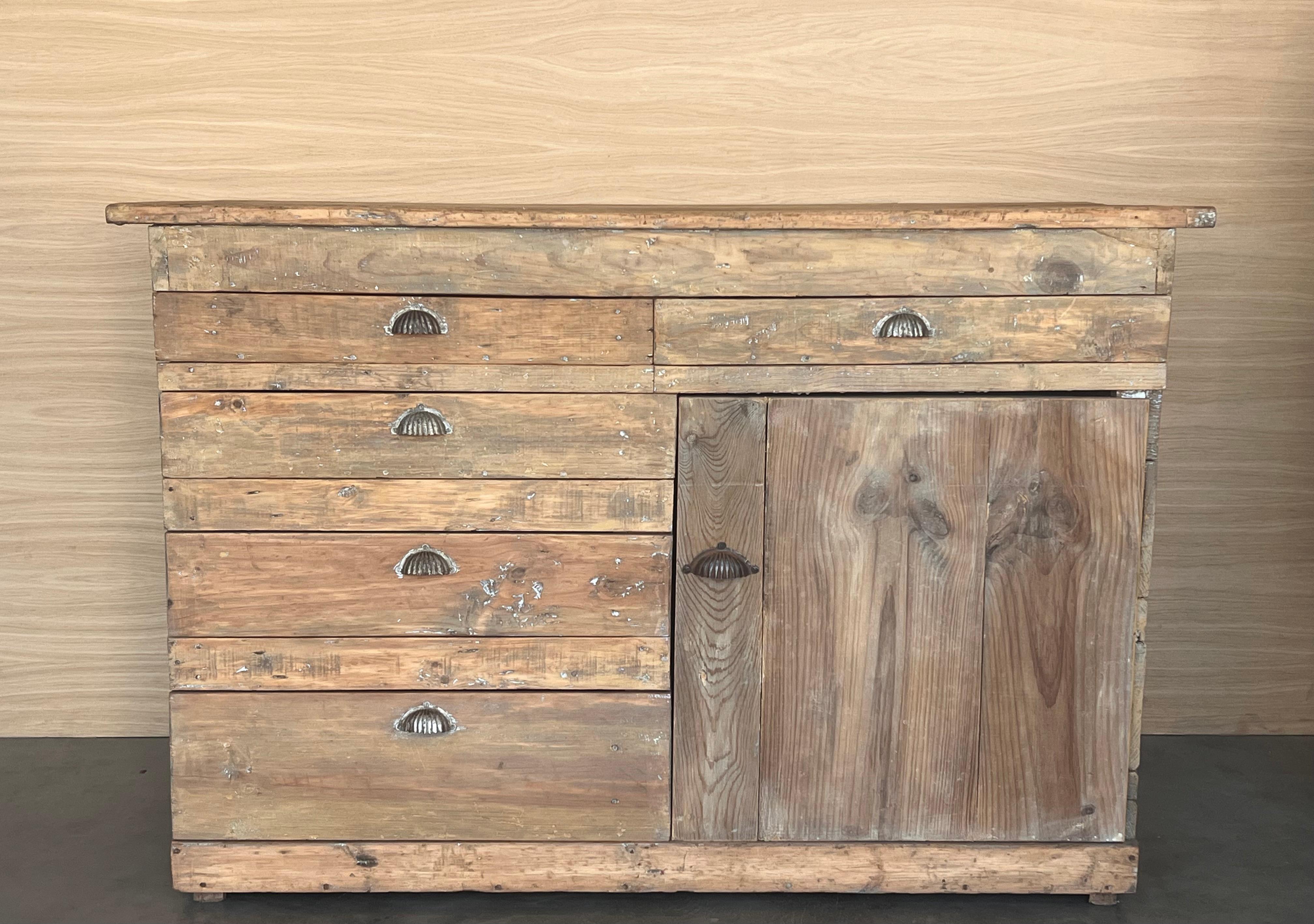 Antique Spanish country pine cabinet or sideboard . The original brown and bleached finish reveals traces of white, and has been distressed over many generations revealing the warm, natural pine patina underneath. Restored, strong and stable.
