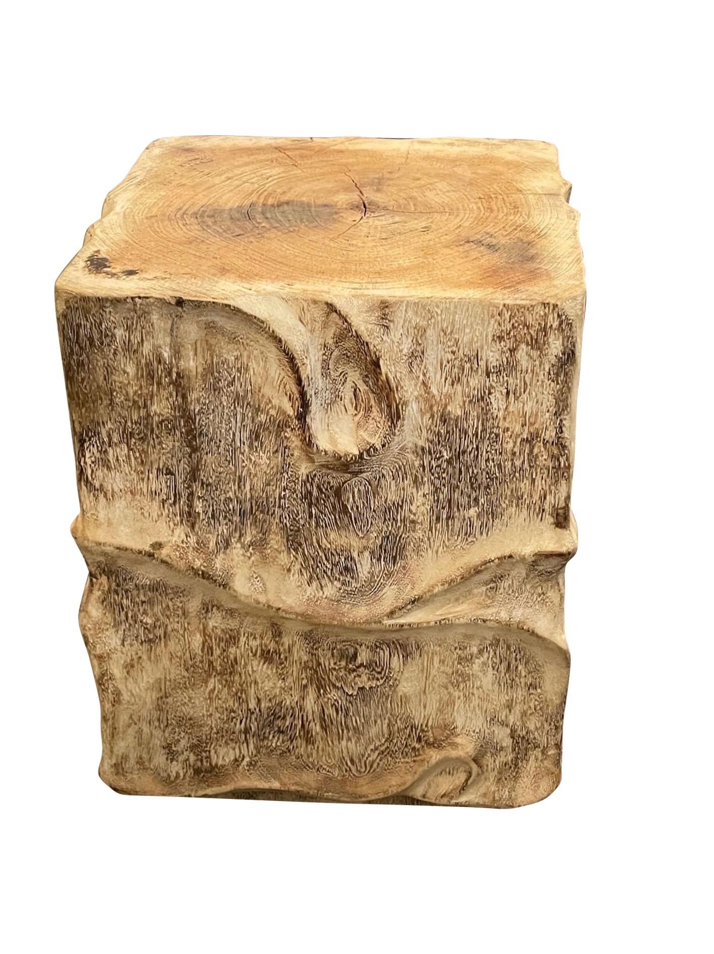 Contemporary Indonesian bleached suar wood square shaped side table.
Decorative carved sides.
Suar wood is one of the most durable hardwoods, having wavy patterns and striking grains.

