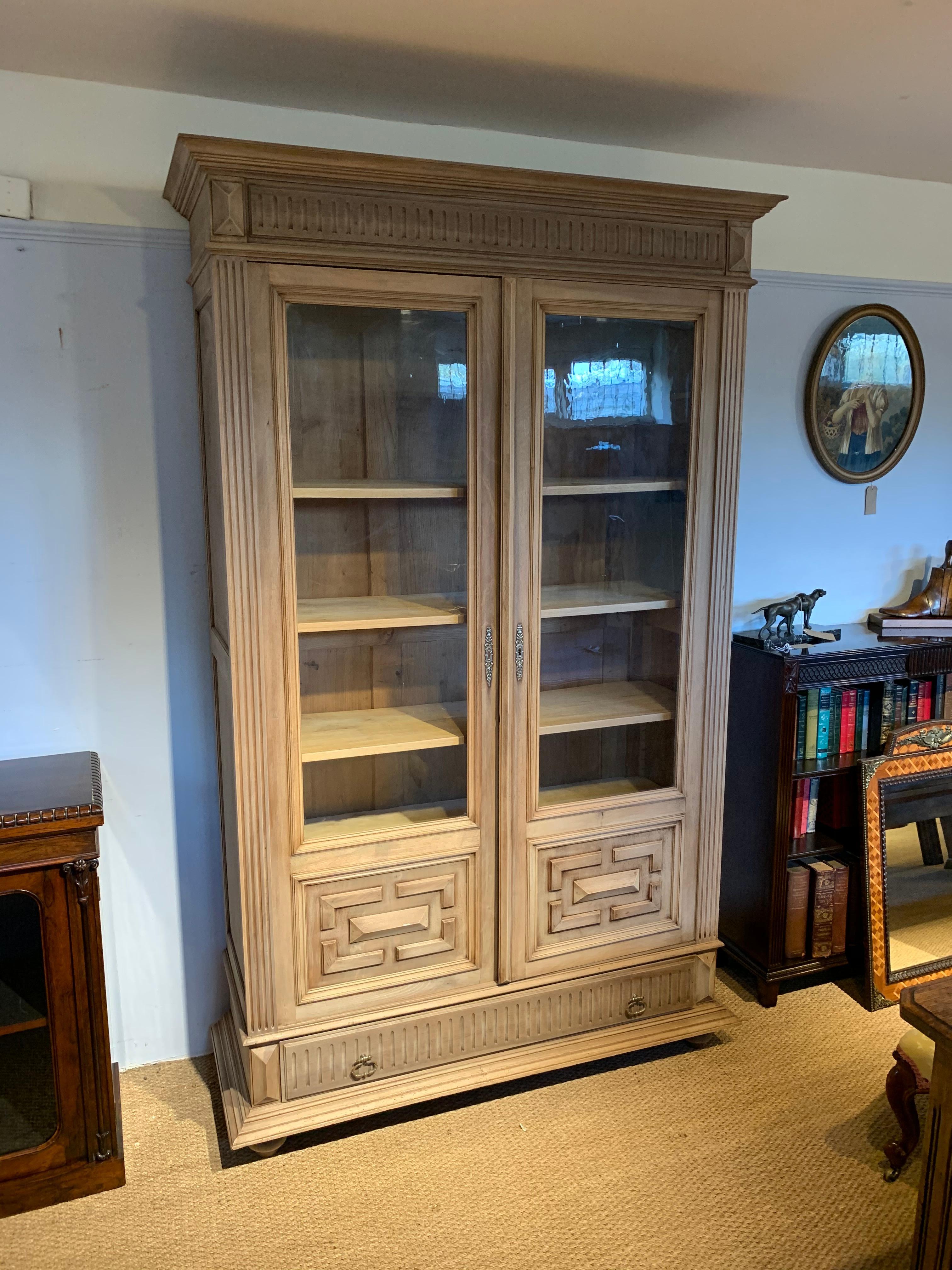 Great late 19th century solid walnut 2 door bookcase , stripped wood finish 

French circa 1890s .having 5 fully adjustable , will be supplied with working lock and key , this piece flat packs for ease of transportation / delivery 

Any woodworm