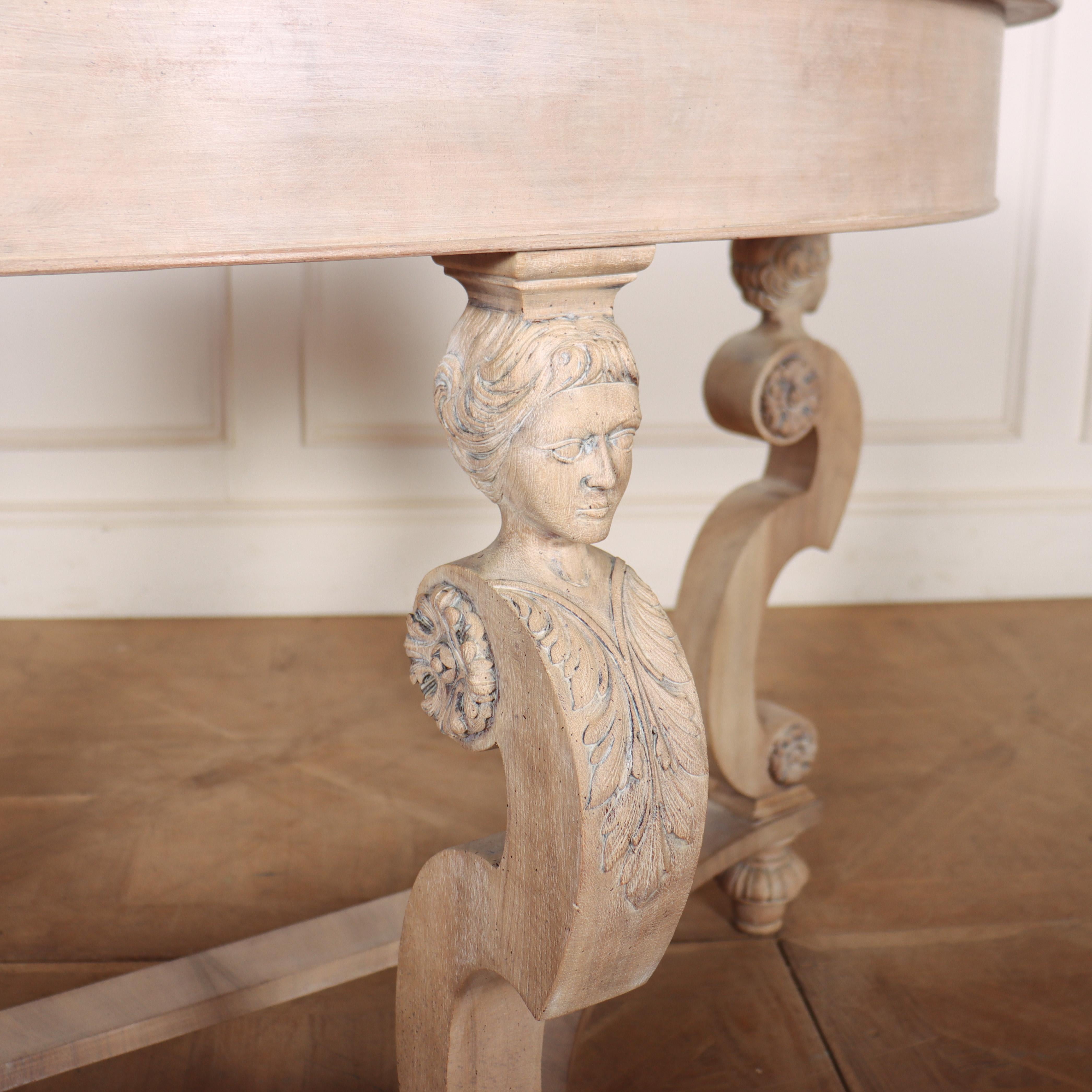 Interesting 19th century continental bleached walnut demi lune console table, decorated with carved figures and shaped legs. 1880.

Code: 8532

Dimensions:
W: 46