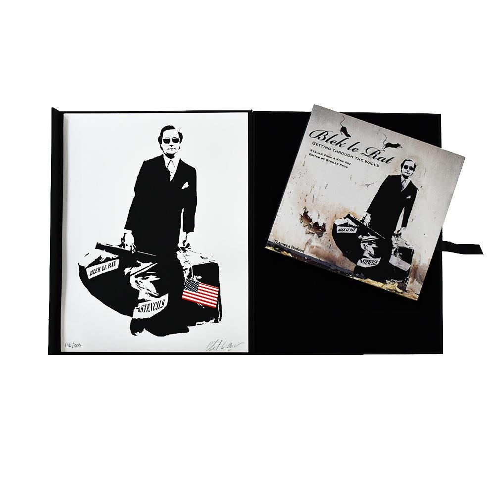 Wonderful Special Edition of Blek Le Rat The Man Who Walks Through Walls.
Comes complete with Screenprint, custom box and Blek Le Rat’s book, Getting Through The Walls.
Self portrait by Blek Le Rat carrying bag of stencils with the USA flag.
Limited