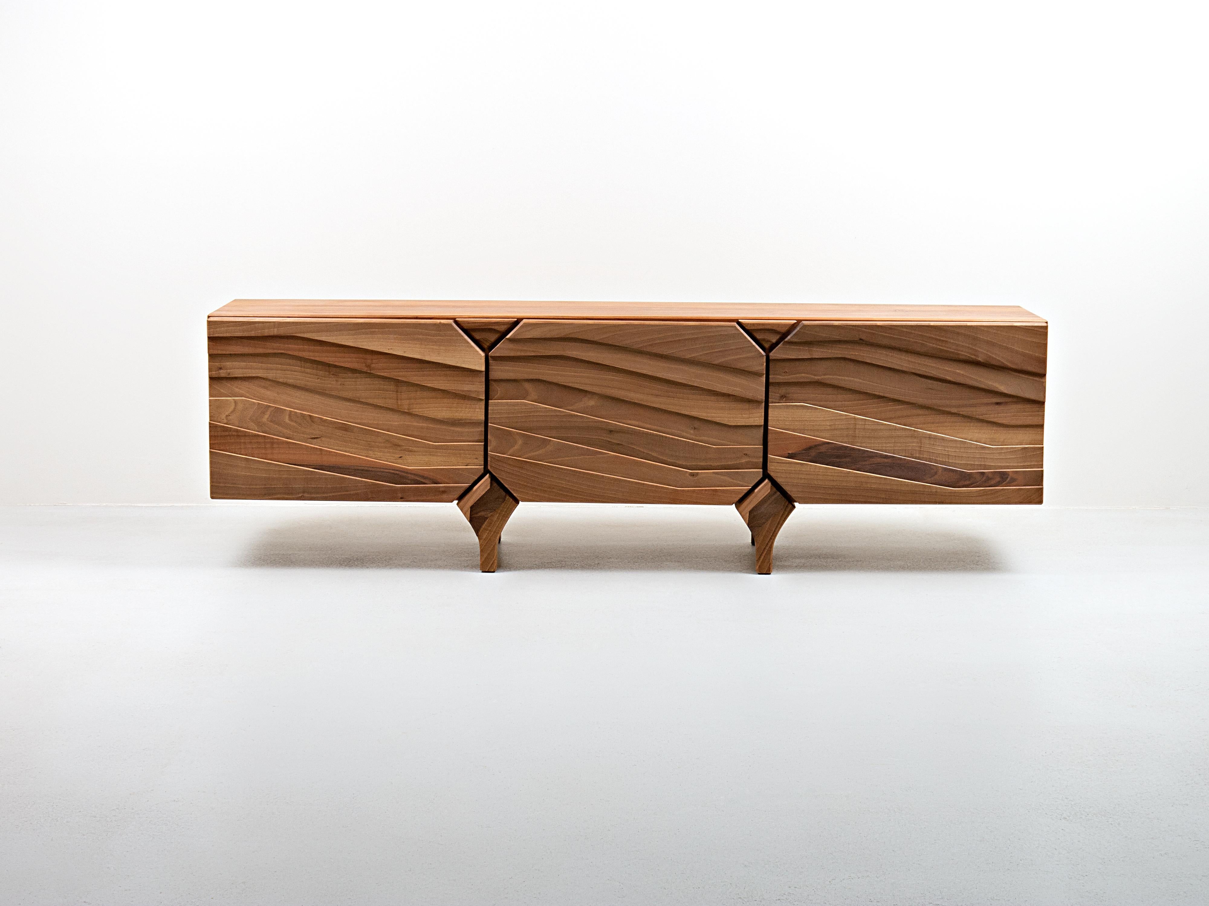 The name of this sidebouard comes from the appearance, that is, profile of its door. The inspiration for the look originates from the old analog camera shutter, where all segments are placed in a similar way as on the door of this chest of drawers.
