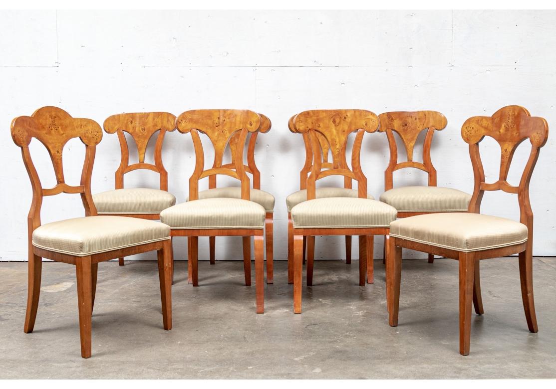 Set of 8 fine Biedermeier style dining room chairs with shaped cresting rails and pierced back-splats. Two of the chairs are compatible and add that unique charm to the set noting the subtle differences in the legs. The chairs with web construction