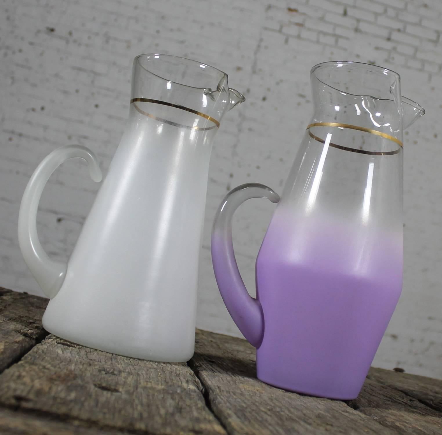 Fun Blendo pitchers by West Virginia Glass Specialty Co. for your cocktails or summer beverages. One white frosted glass with gold trim and one lavender frosted glass with gold trim. Both are in great vintage condition with no chips, cracks or
