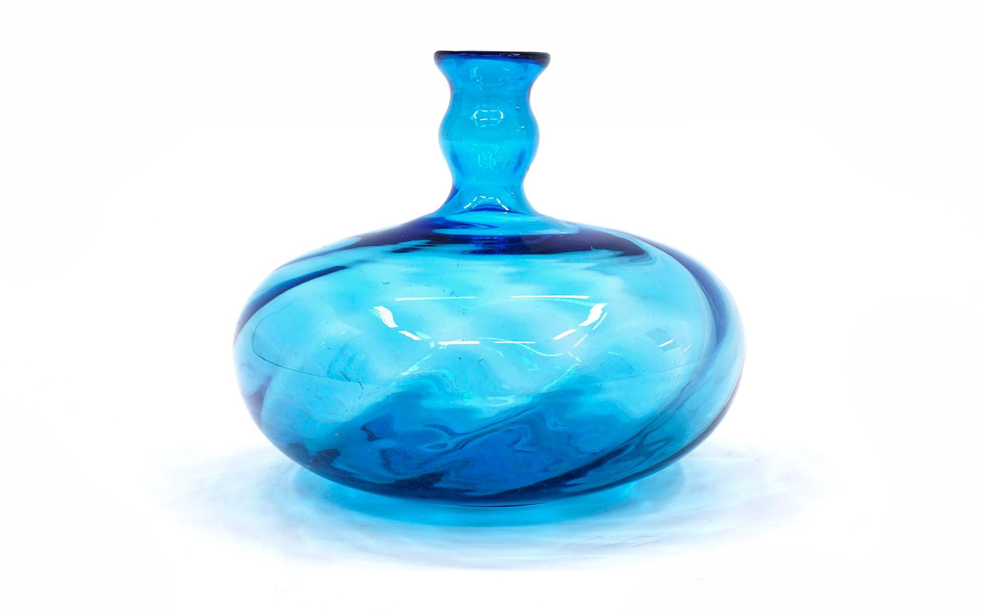 Art Glass vase in blue by Blenko, 1960s. Hand blown bulbous with undulating wave like form. No chips, cracks or repairs.