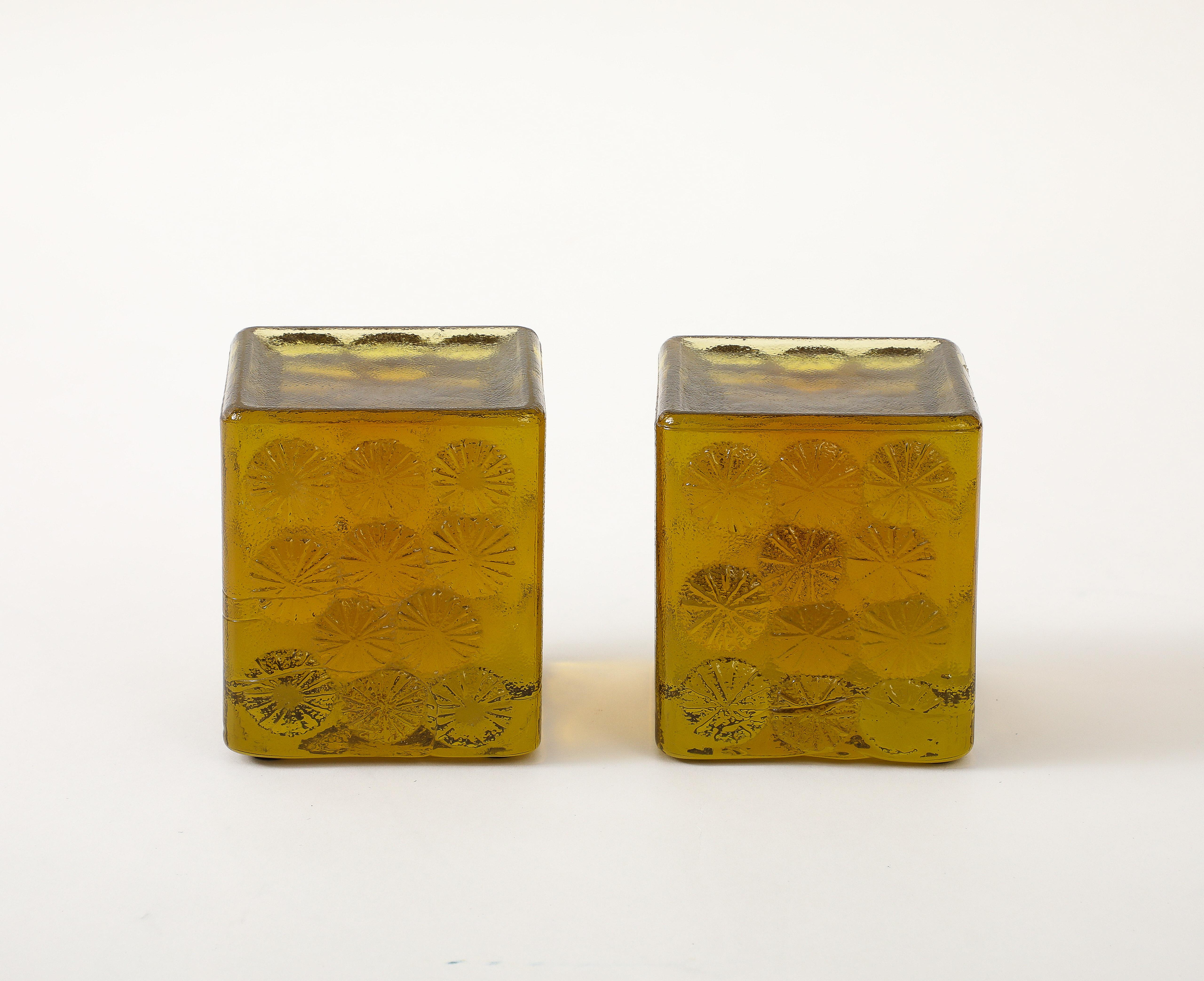 Mair of solid glass acid green block bookends with stylized flower fronts and backs. Blenko Glass.