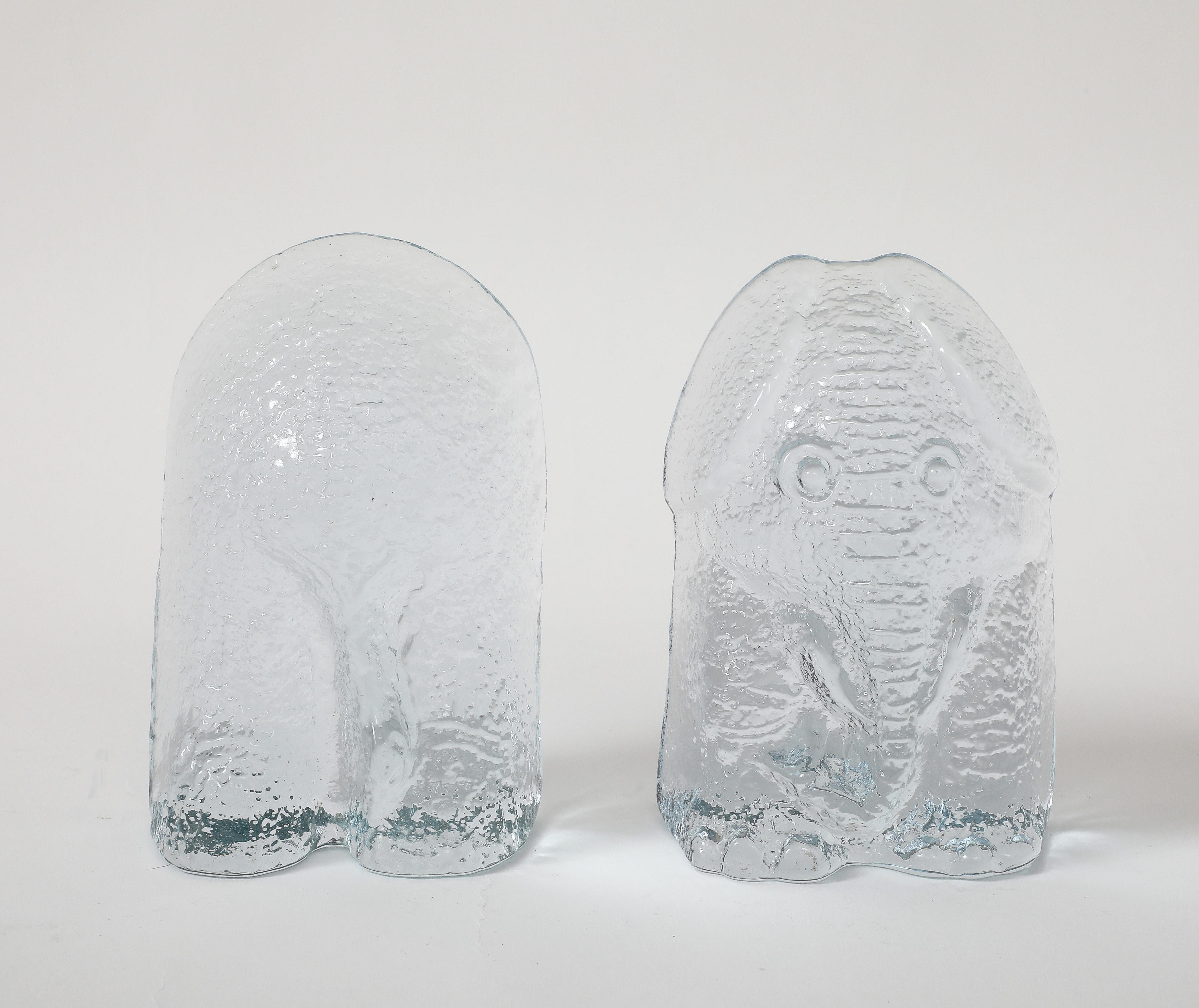 Modernist set of tinted ice blue glass stylized elephant bookends. Blenko Glass Co.