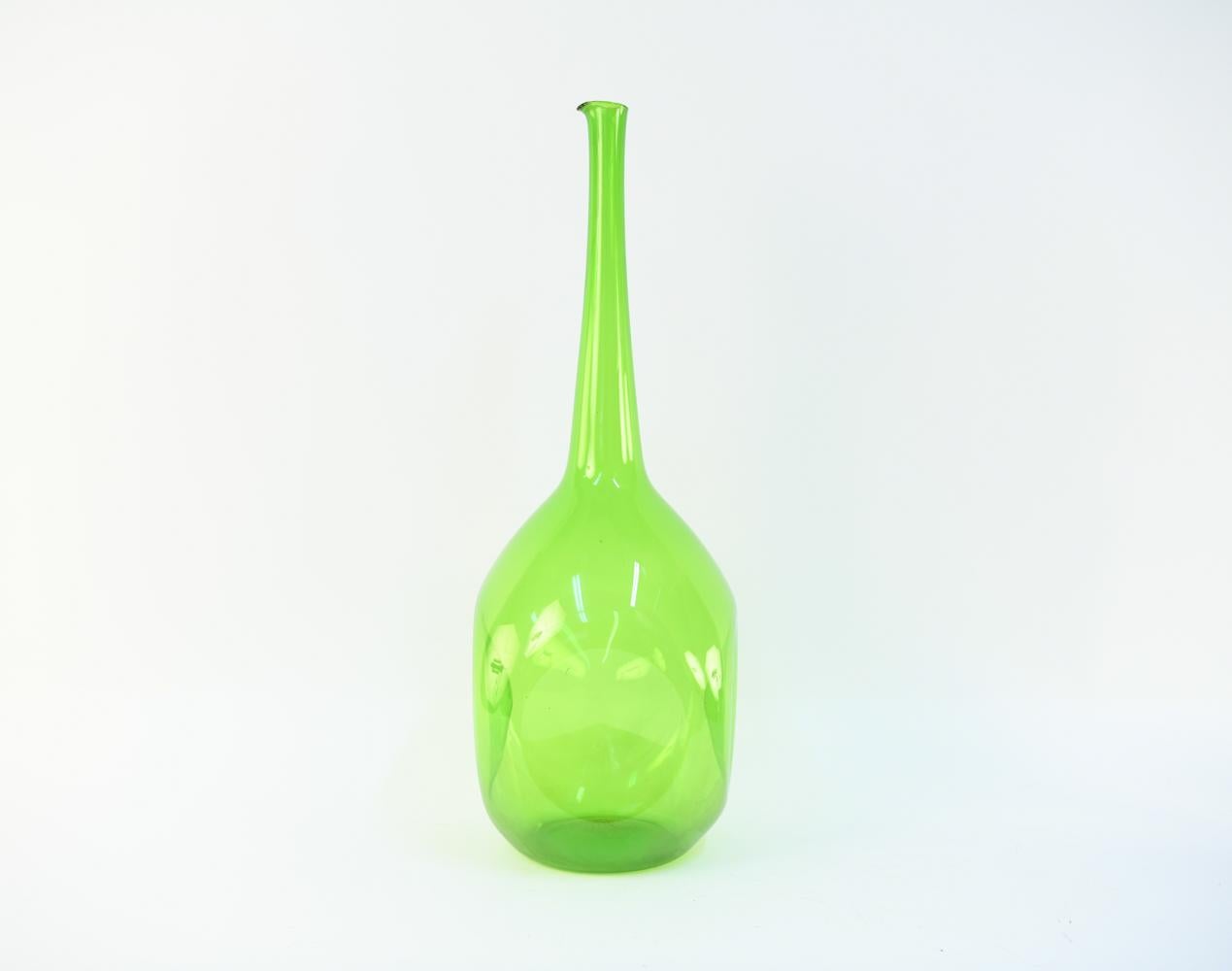 This is a gorgeous midcentury bottleneck glass vase by Blenko. In a striking lime green.