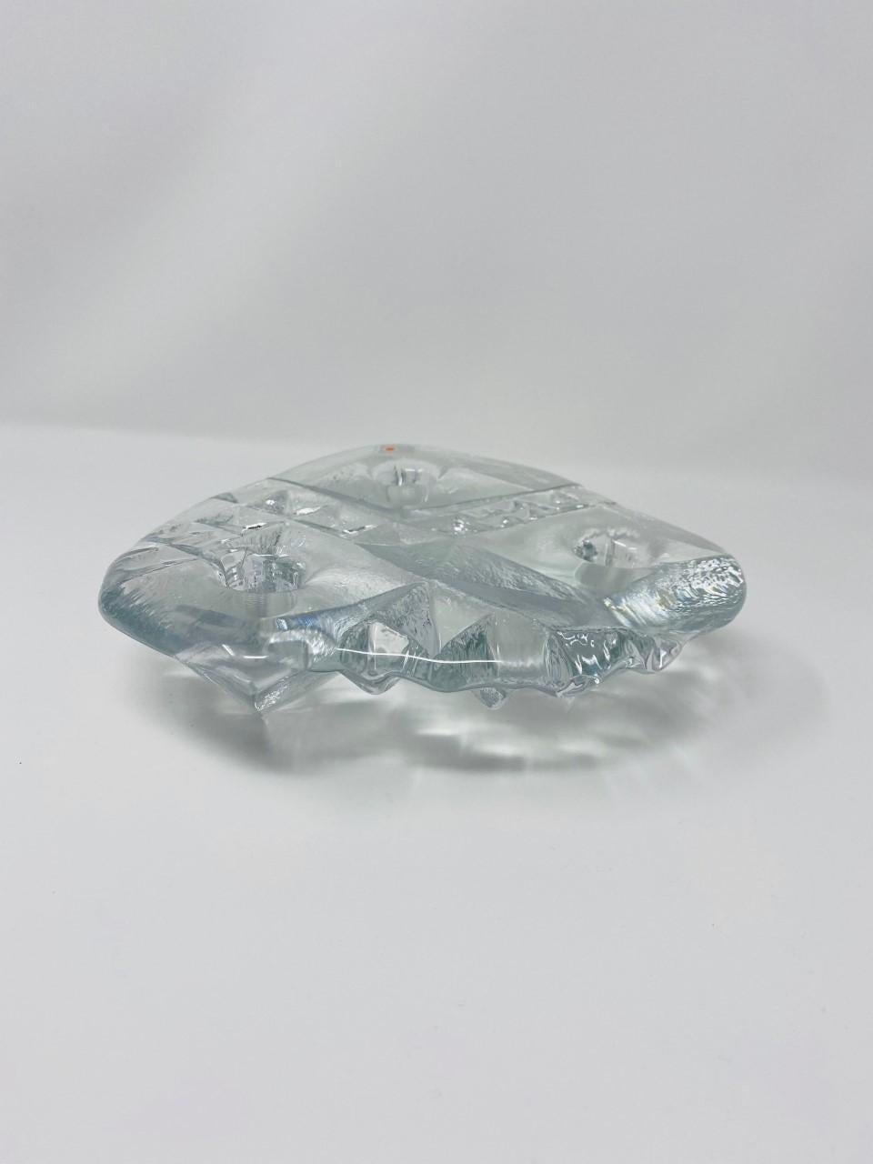 A Classic beautiful glass candleholder by Blenko. Diamond like and Alien like at the same time. This vintage design by the house of Blenko is truly modern and timeless. This candleholder is handmade and executed beautifully out of glass. The lines