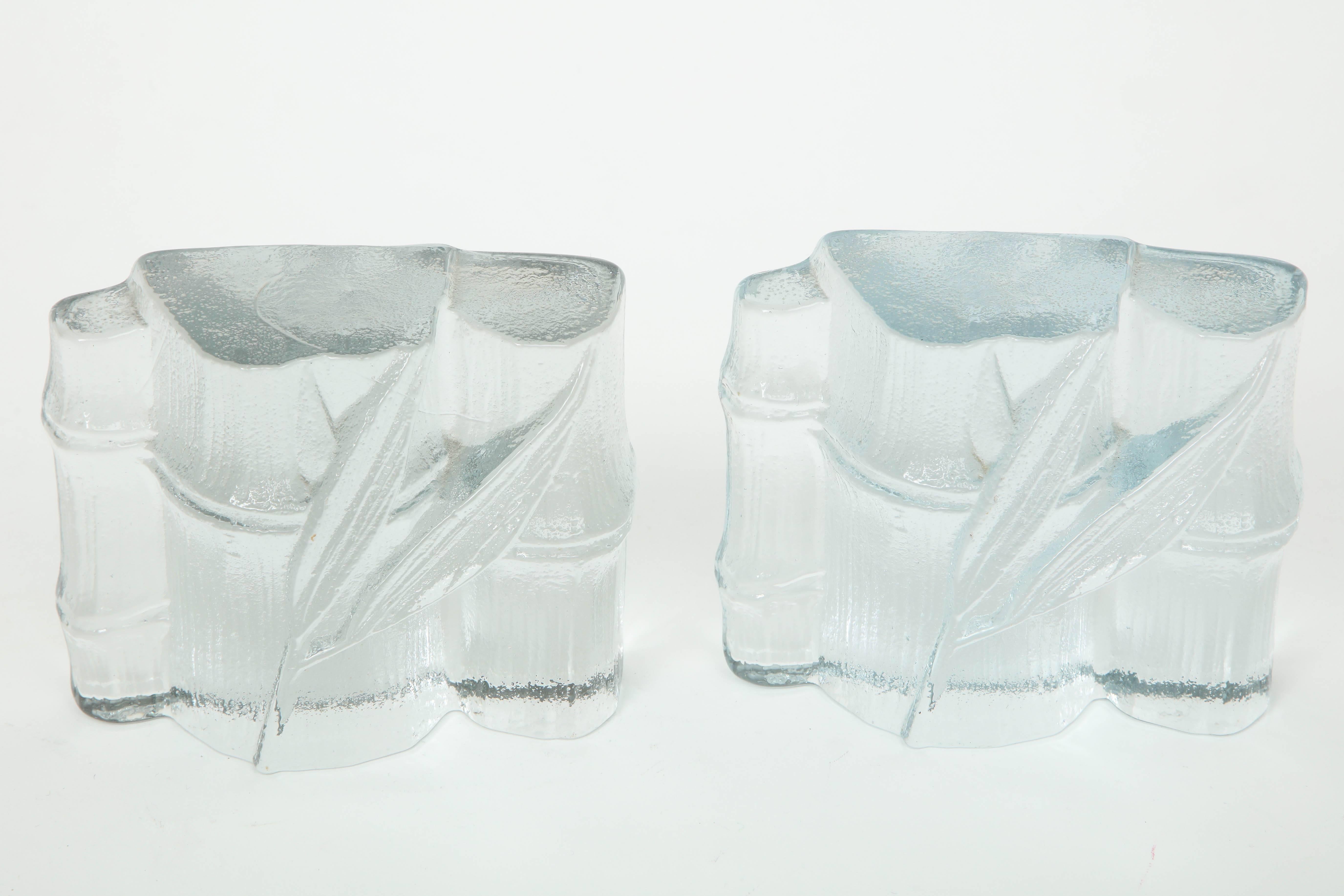 Pair of cast clear glass bookends with a stylized bamboo motif by Blenko.