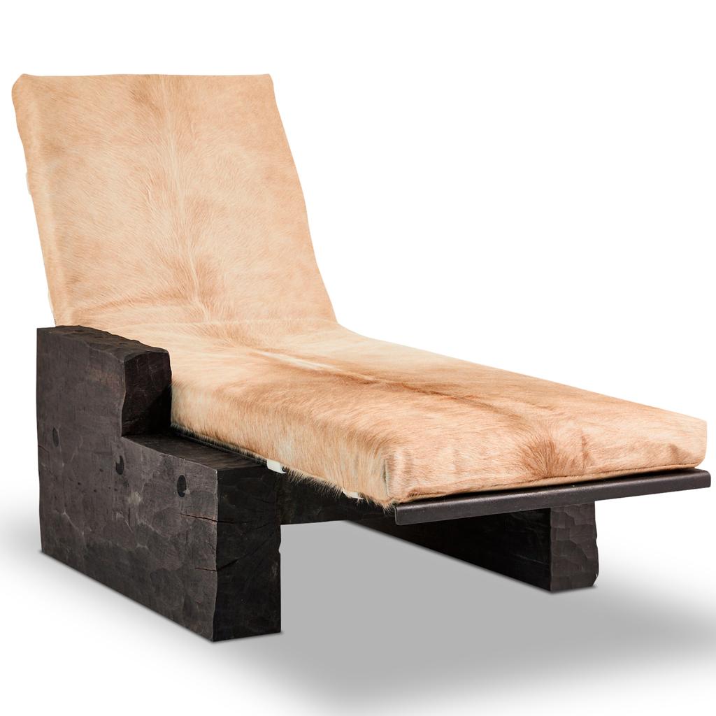 This daybed is part of our Blessing collection.
This modern, Brutalist inspired daybed is set on a hand carved hardwood base which is burnished and polished black. The base supports a steel section which has a hair on hide, removable cushion. The