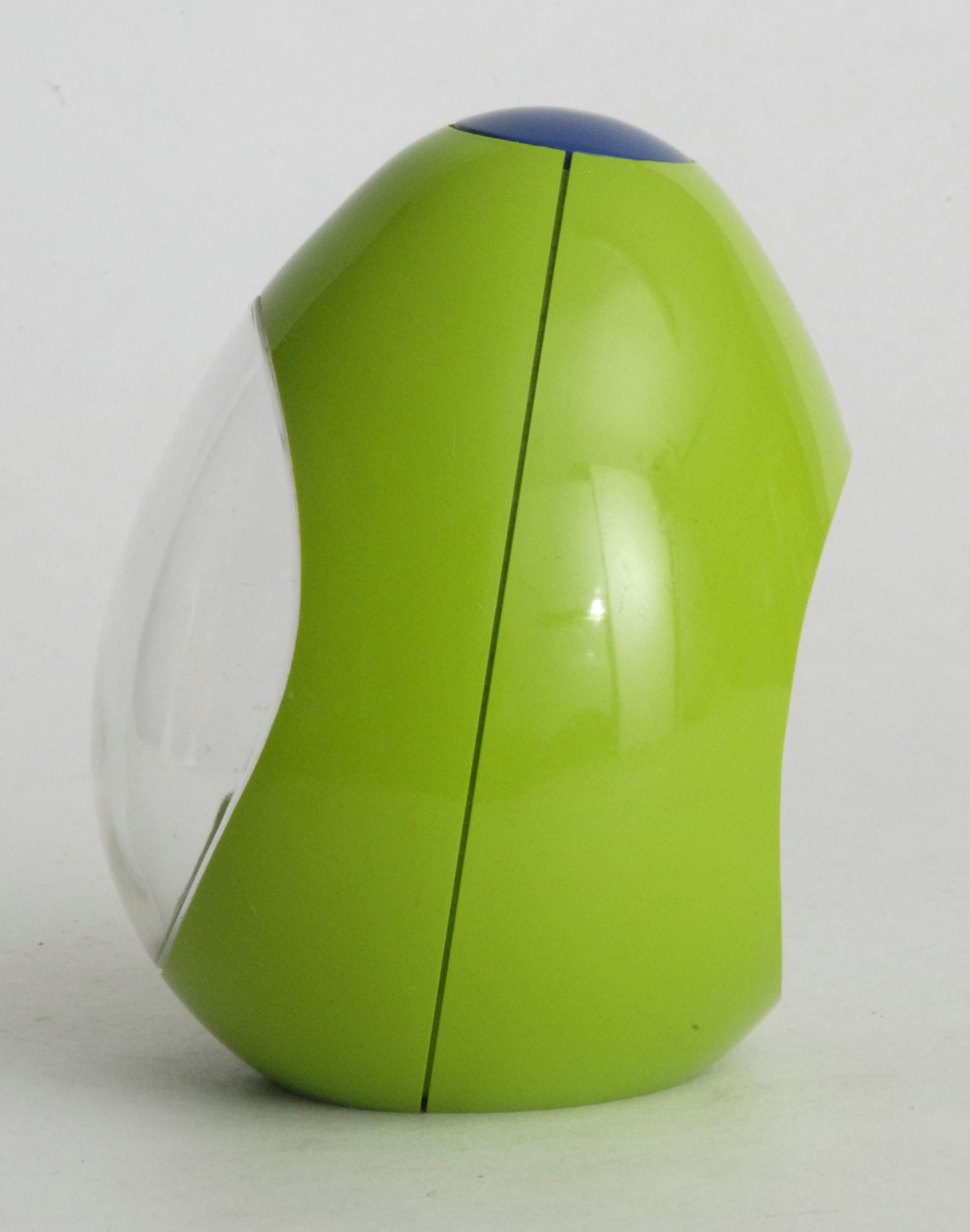 A pear or egg shaped clock in bright green and blue. An alarm clock with separate spring mechanisms for the time and alarm winding. A non pedestal clock in a rare shape.