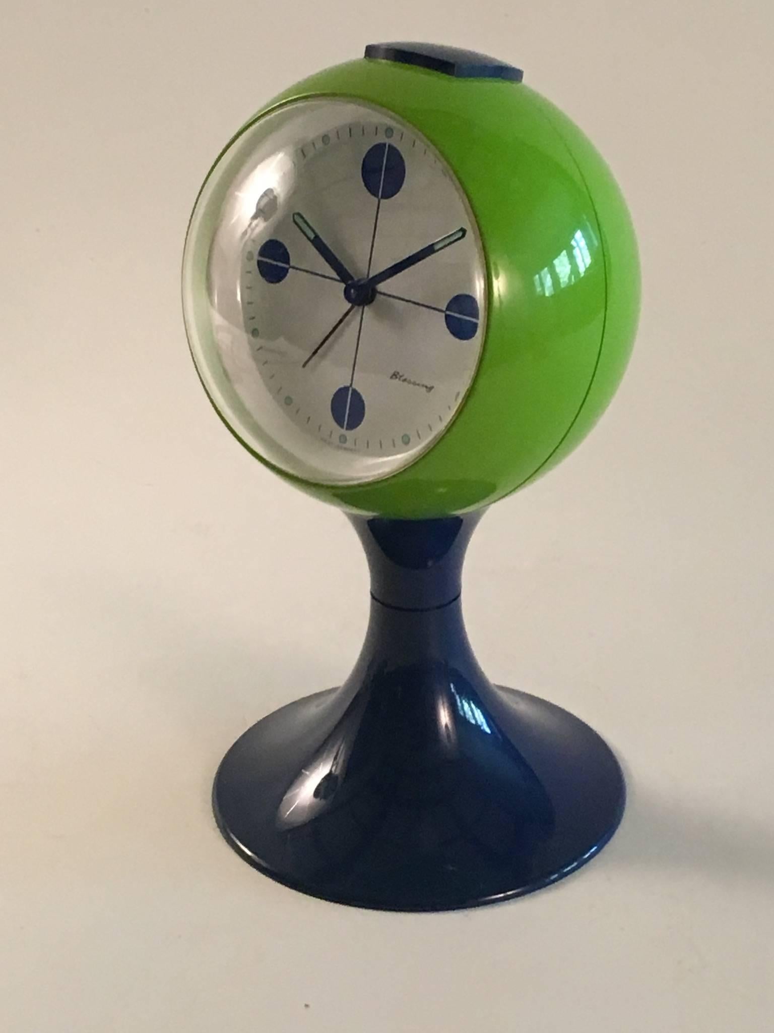 A good Blessing mechanical pedestal clock from the 'space race' era of the late 1960s. In excellent condition complete with its back cover plate over the winding knobs. The blue and green plastic is bright and shiny without any blemishes and it