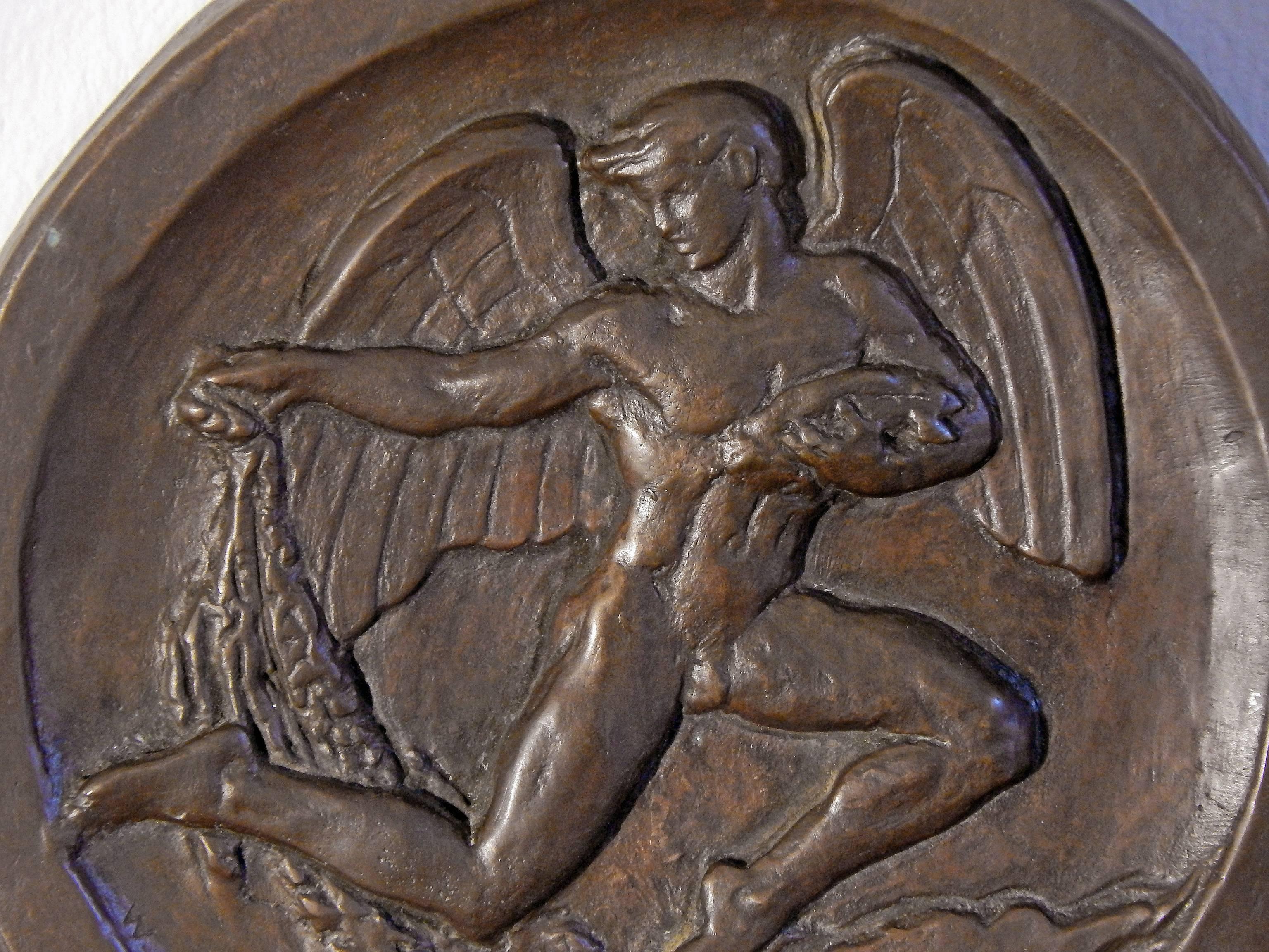 Sculpted by Walker Hancock, who spent many summers in the Gloucester area north of Boston, surrounded by fishermen, fishing boats and other evidence of the industry, this rare bas relief rondel depicts a nude male angel with a fish in one arm and a